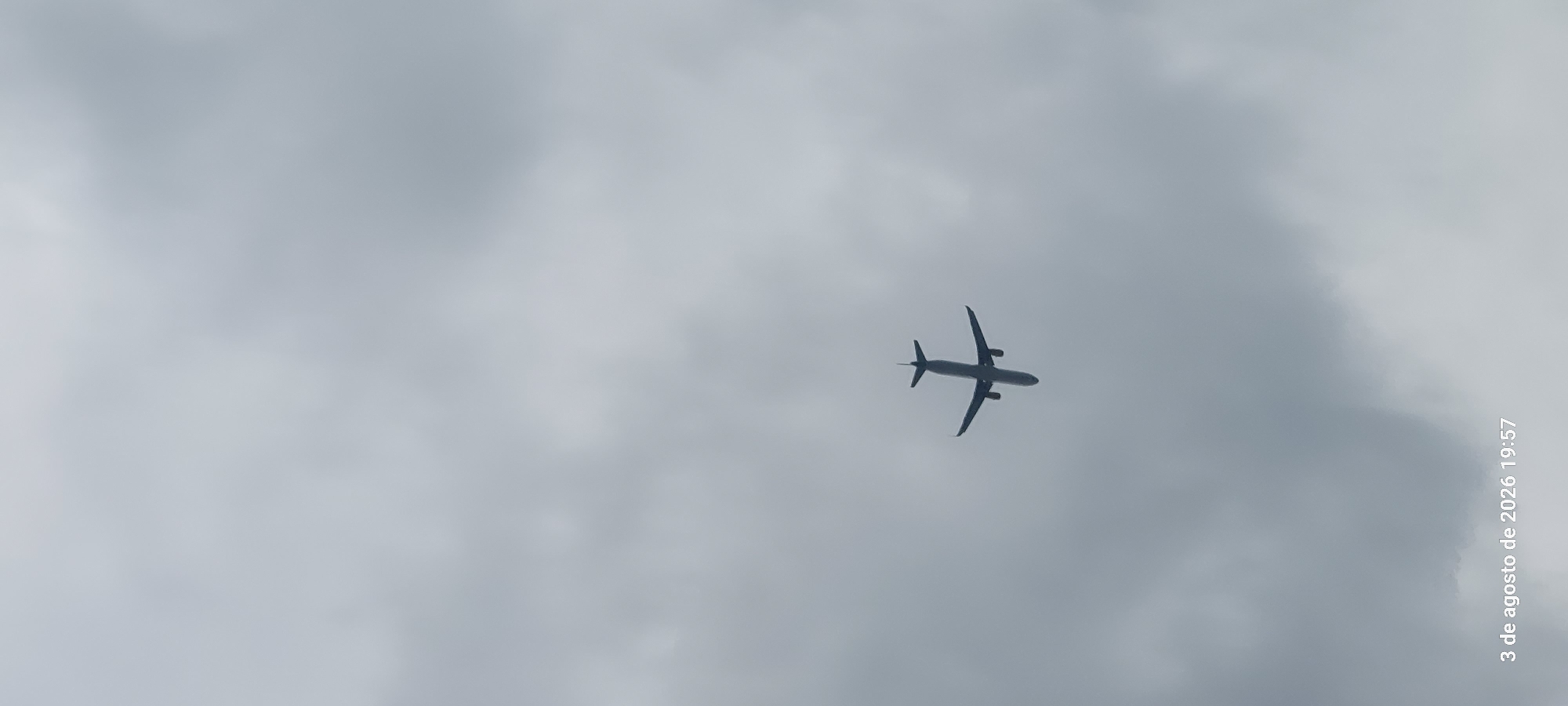 Cloudy summer afternoon at Castelldefels beach, planes overhead