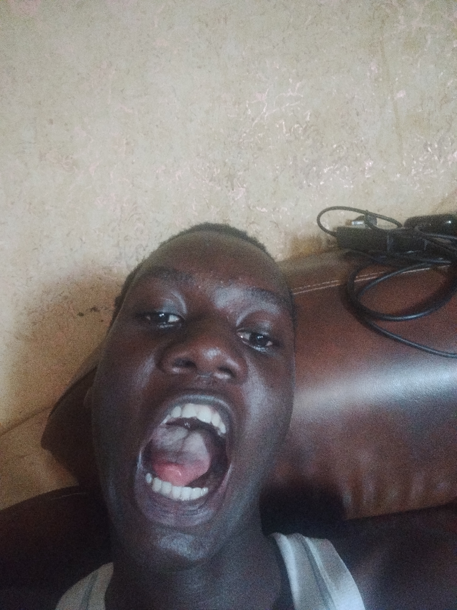 Young person captures expressive selfies in Shangisha, Nigeria