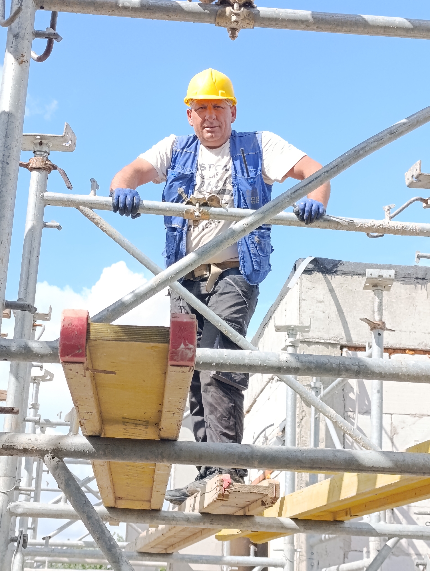 Construction crew at work on a scaffolded site