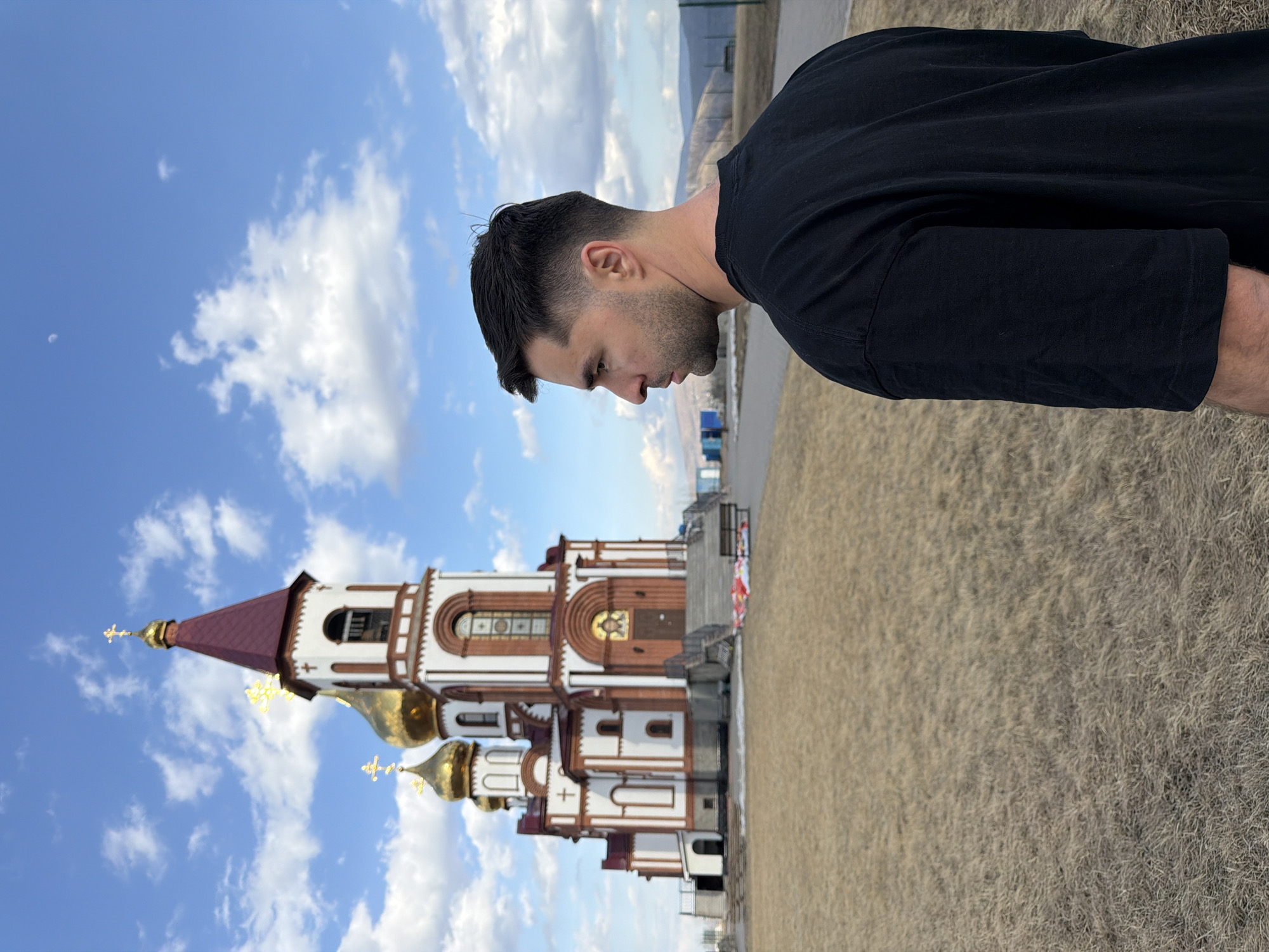 Man mimics Christ statue pose at Krasnoyarsk chapel