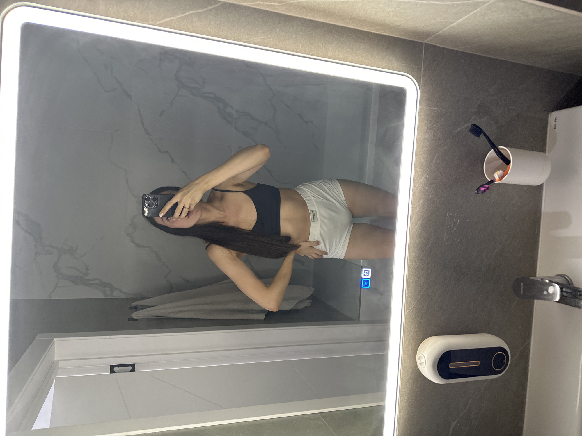 Woman takes repeated bathroom mirror selfies in Russia
