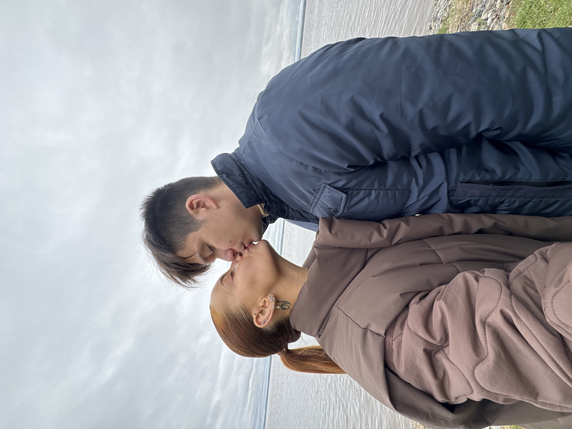 Couple shares romantic moment on pier in Chastyye, Russia