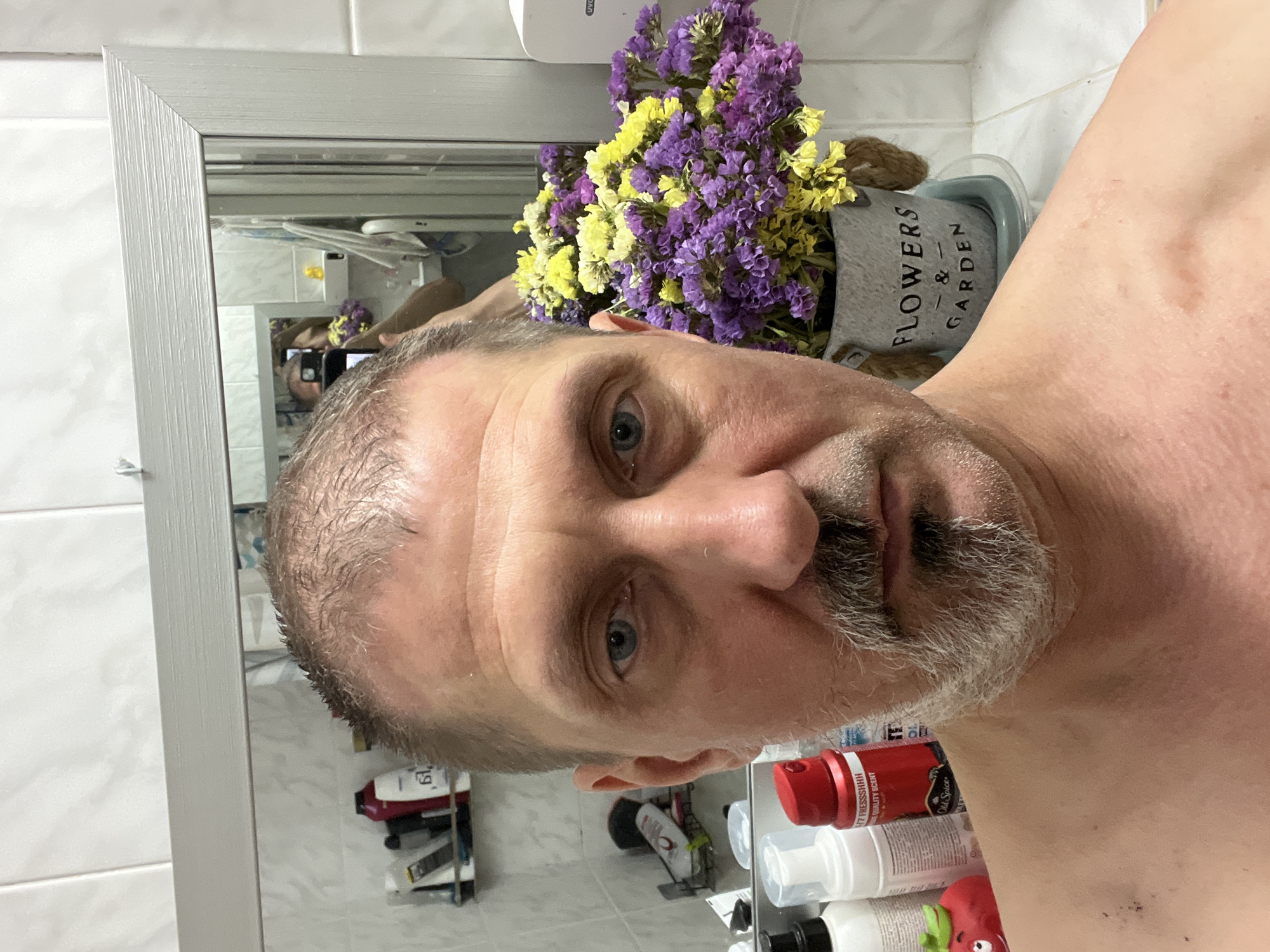 Charcoal mask day at home with an orange cat in Kyiv