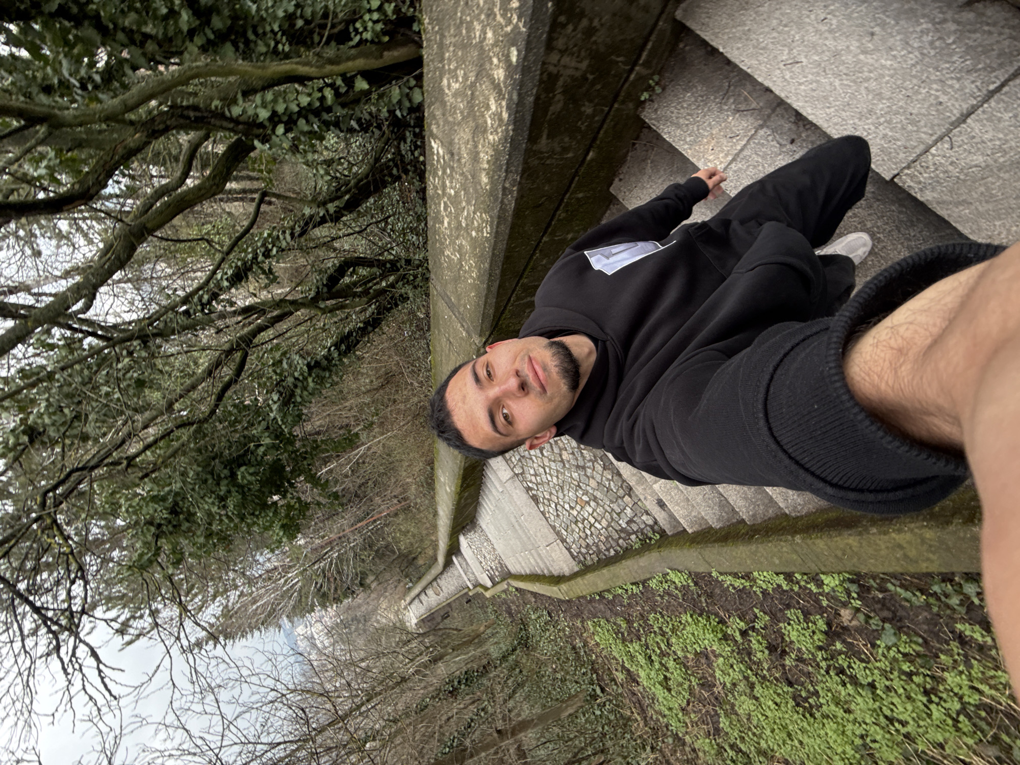 Person takes selfie on stone stairs in Shumen