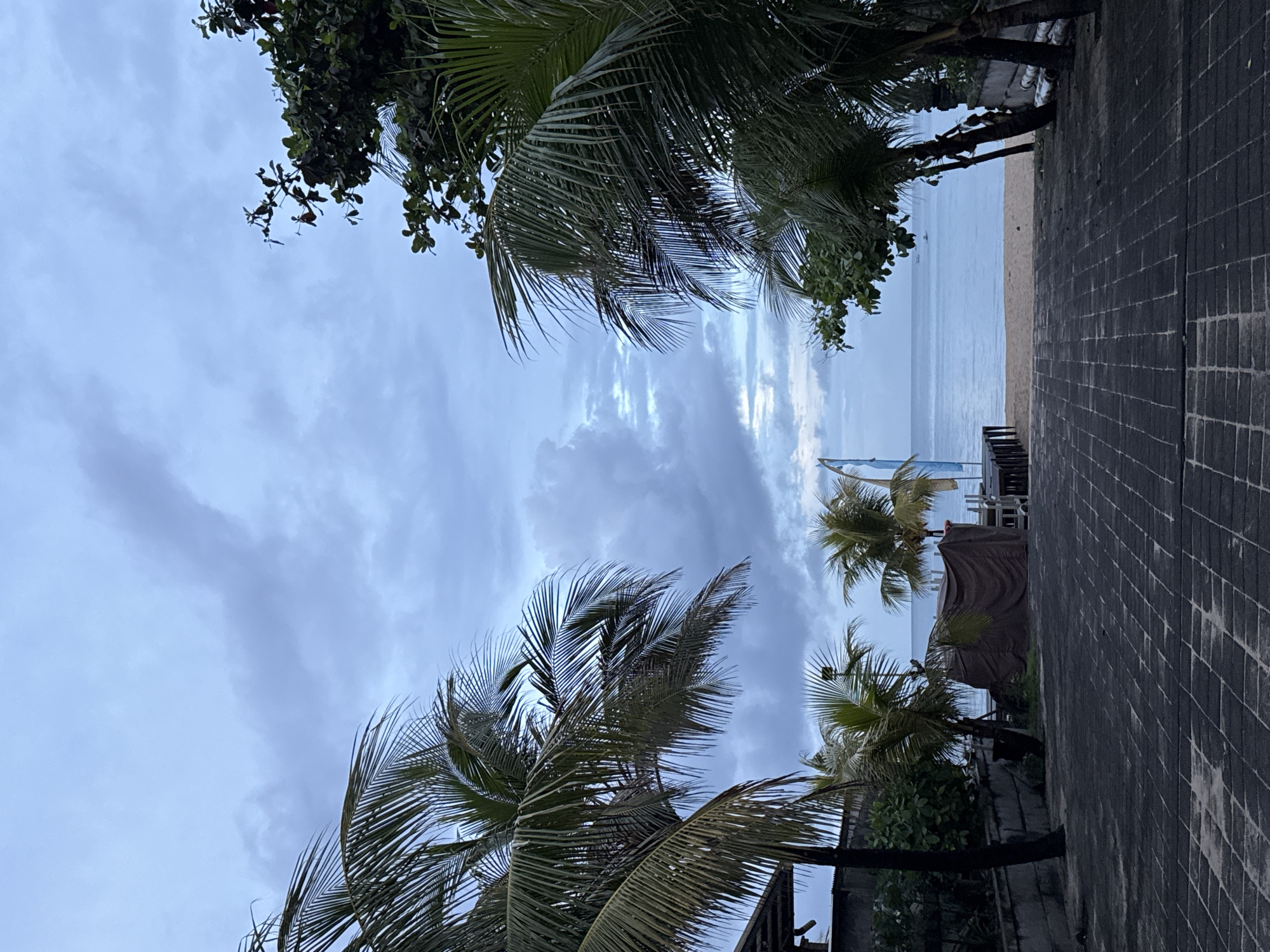Overcast evening captured along Kuta's tranquil oceanfront walkways