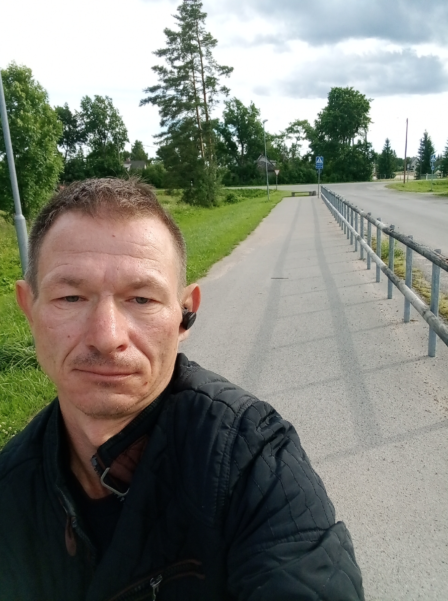 Afternoon stroll along a quiet paved path in Tapa, Estonia