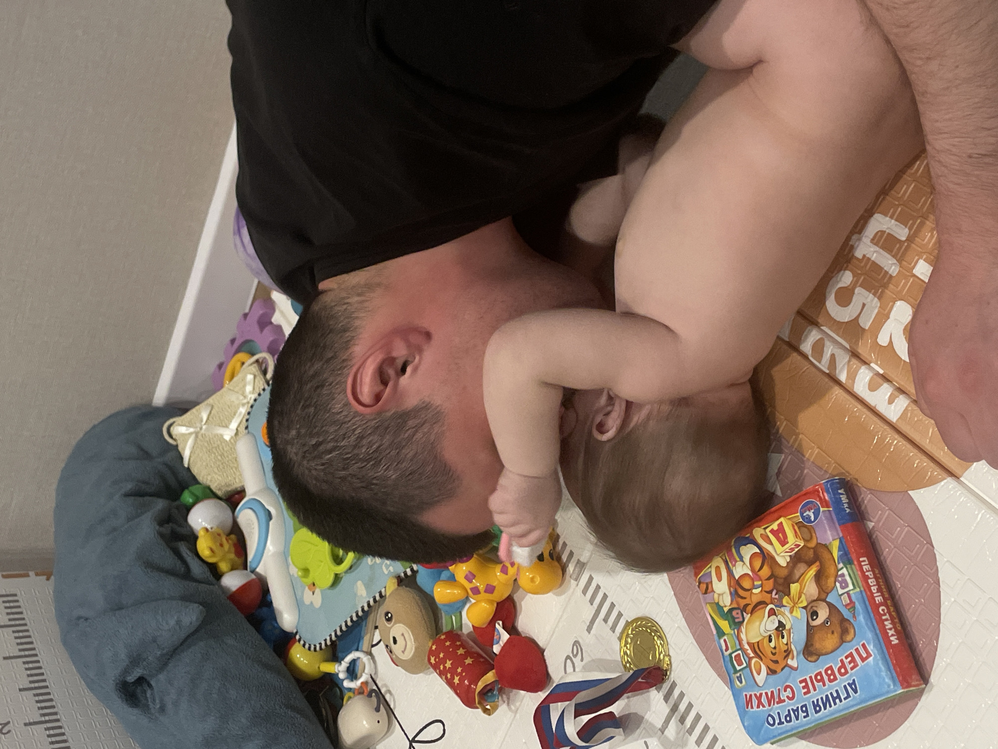 Father and baby share playtime in Подшивалово, Russia