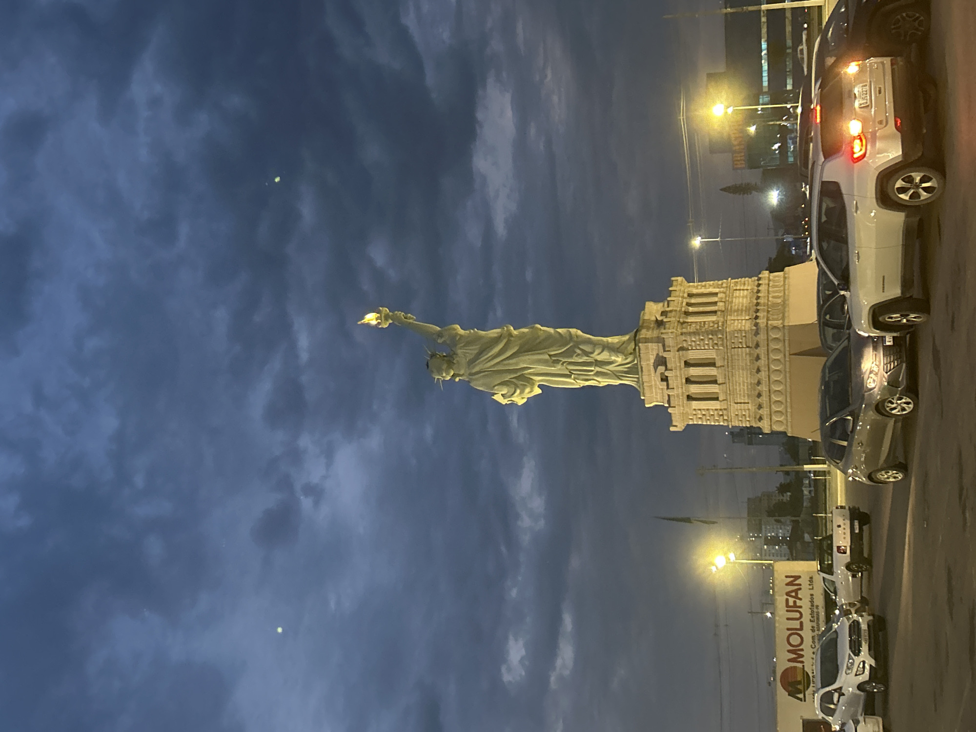 Statue of Liberty replica glows at dusk in Palhoça, Brazil