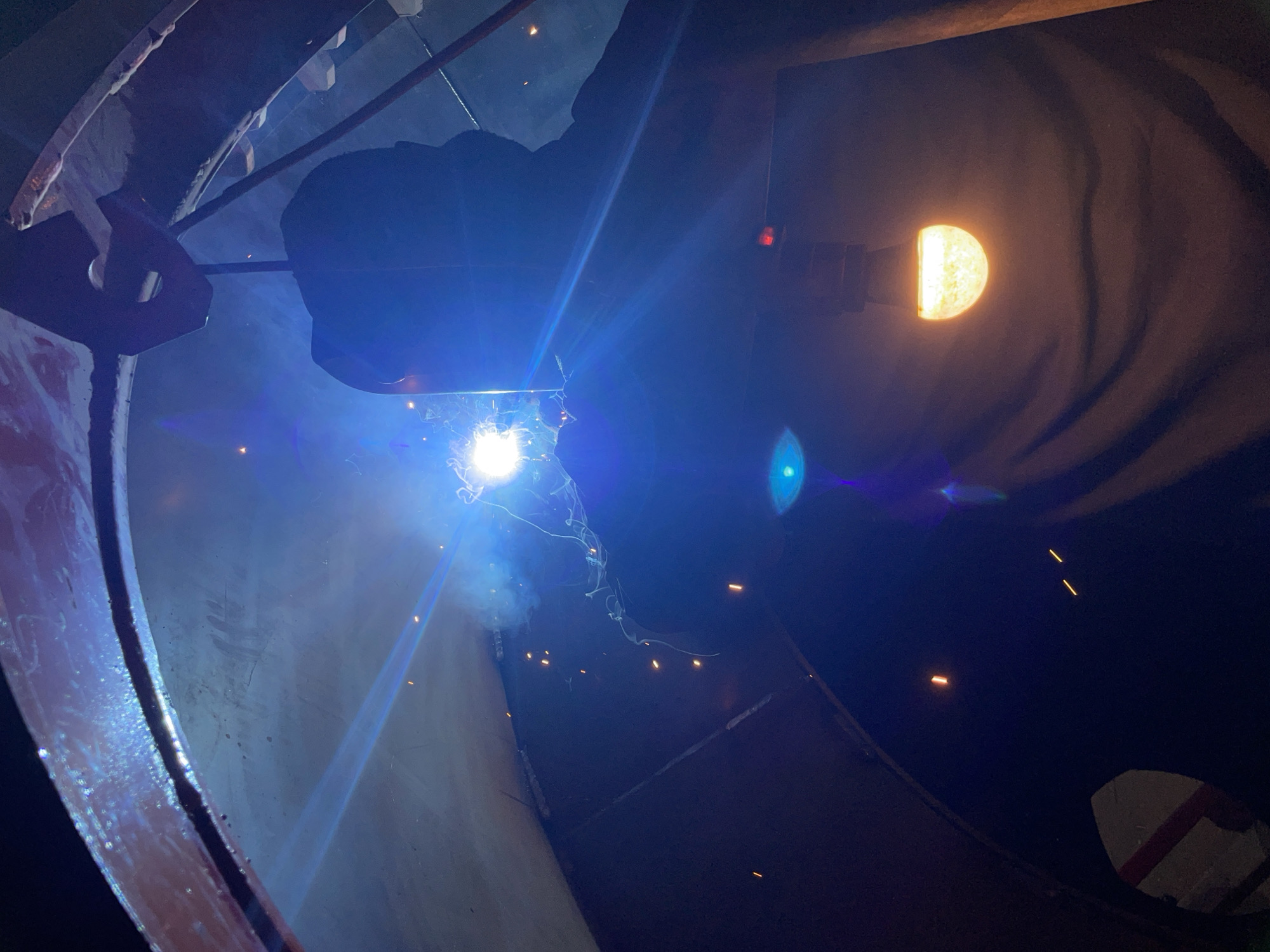 Early morning welding work inside cylindrical structure in Montenegro