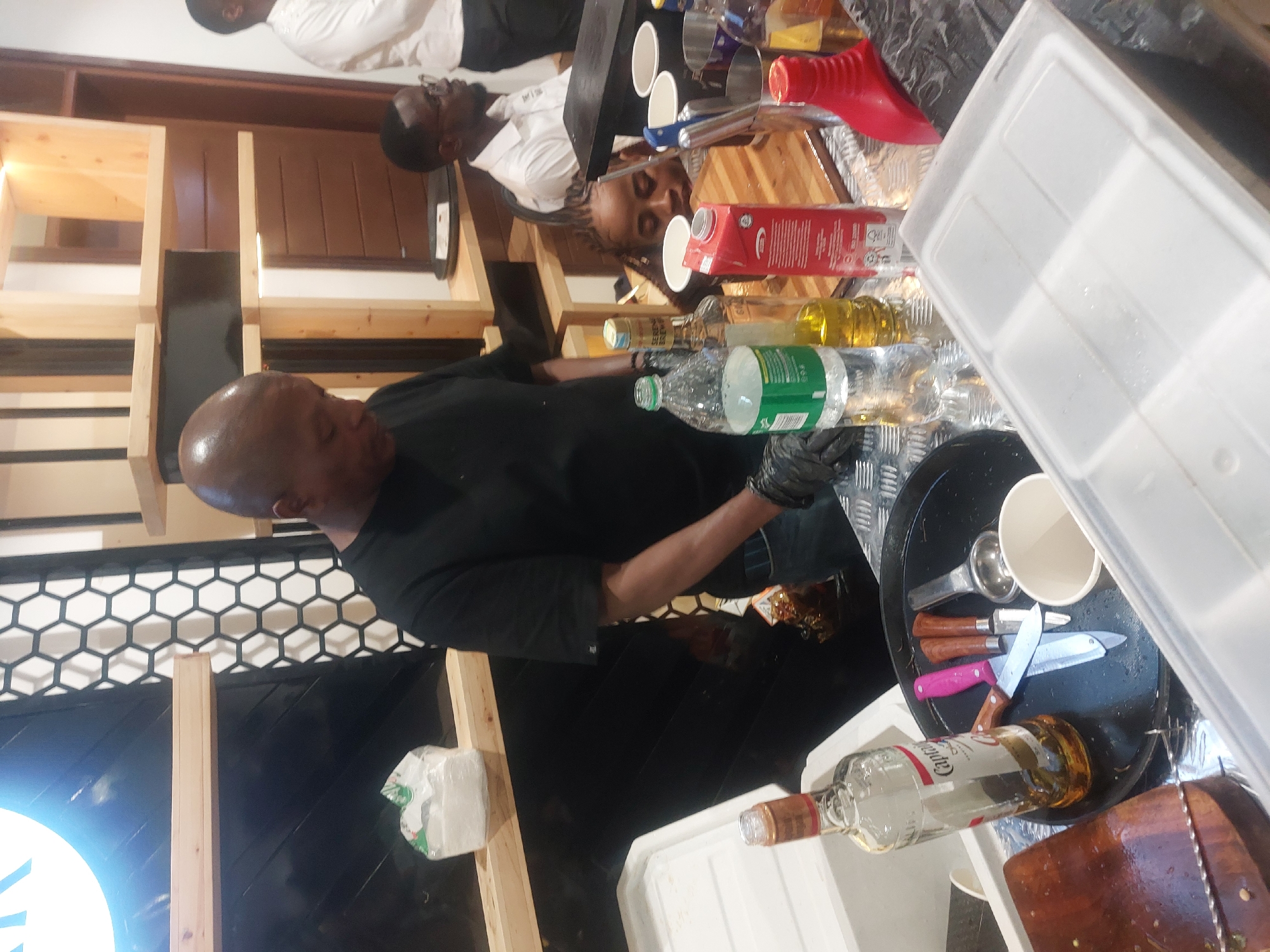 Bartenders serve drinks at makeshift bar in Dar es-Salaam