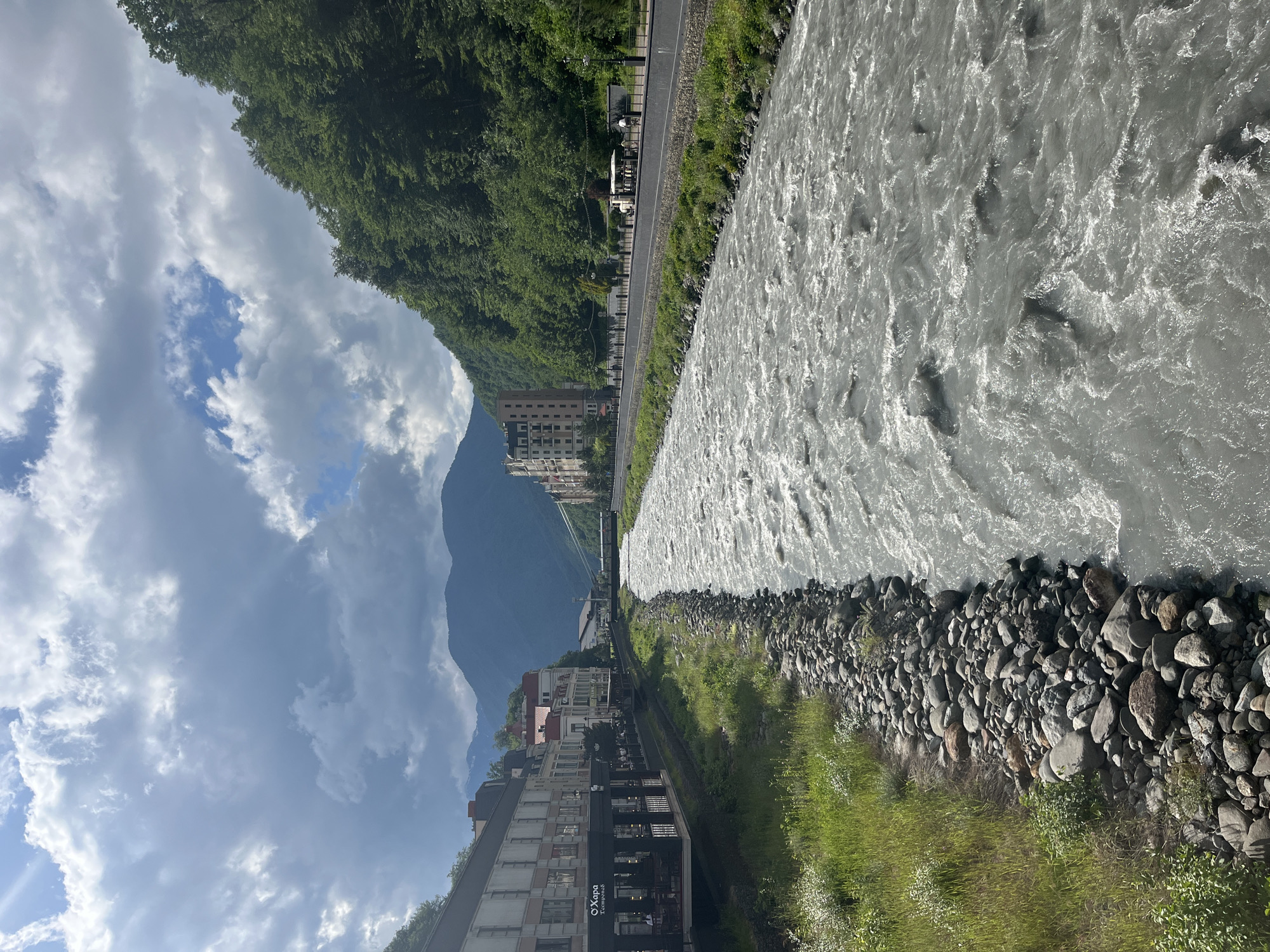 Afternoon on the bridge in Estosadok, glacial river rushing below