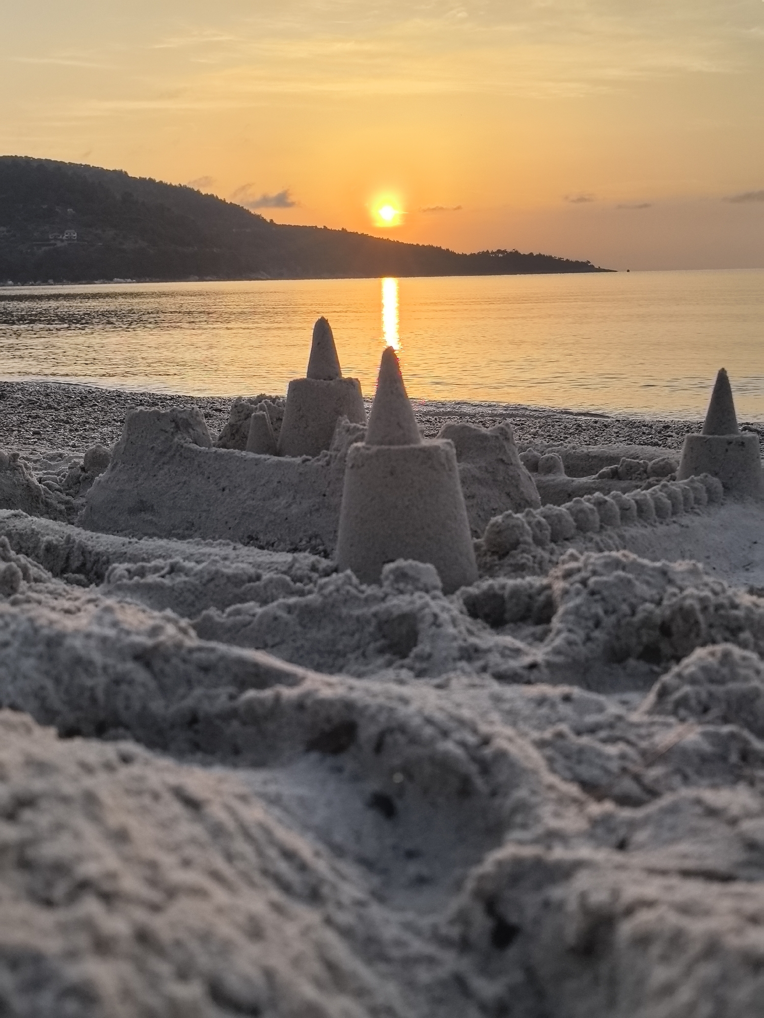 Sandcastle at golden hour, Golden Beach, Greece