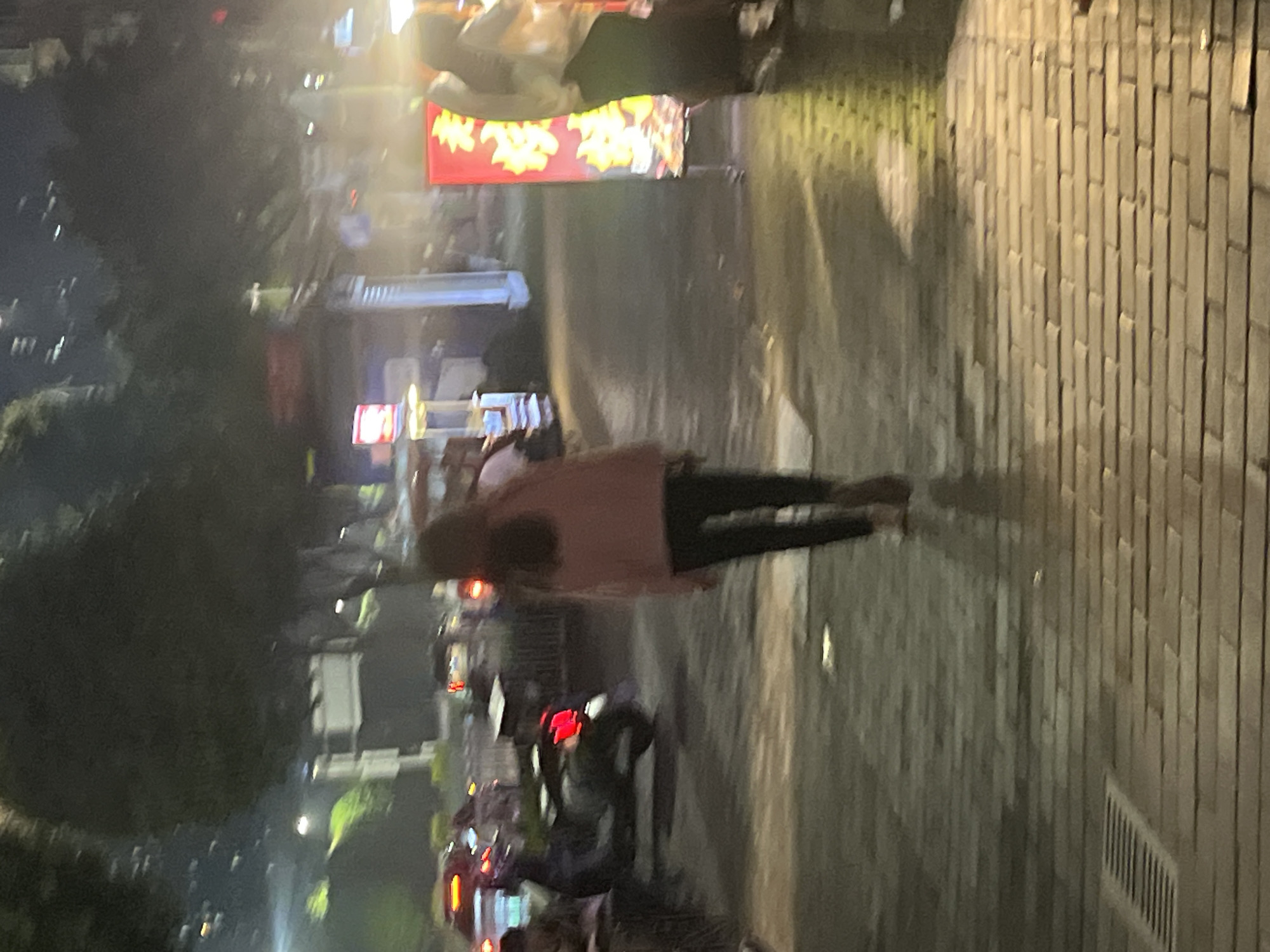 Night street activity captured in Shapingba District, China