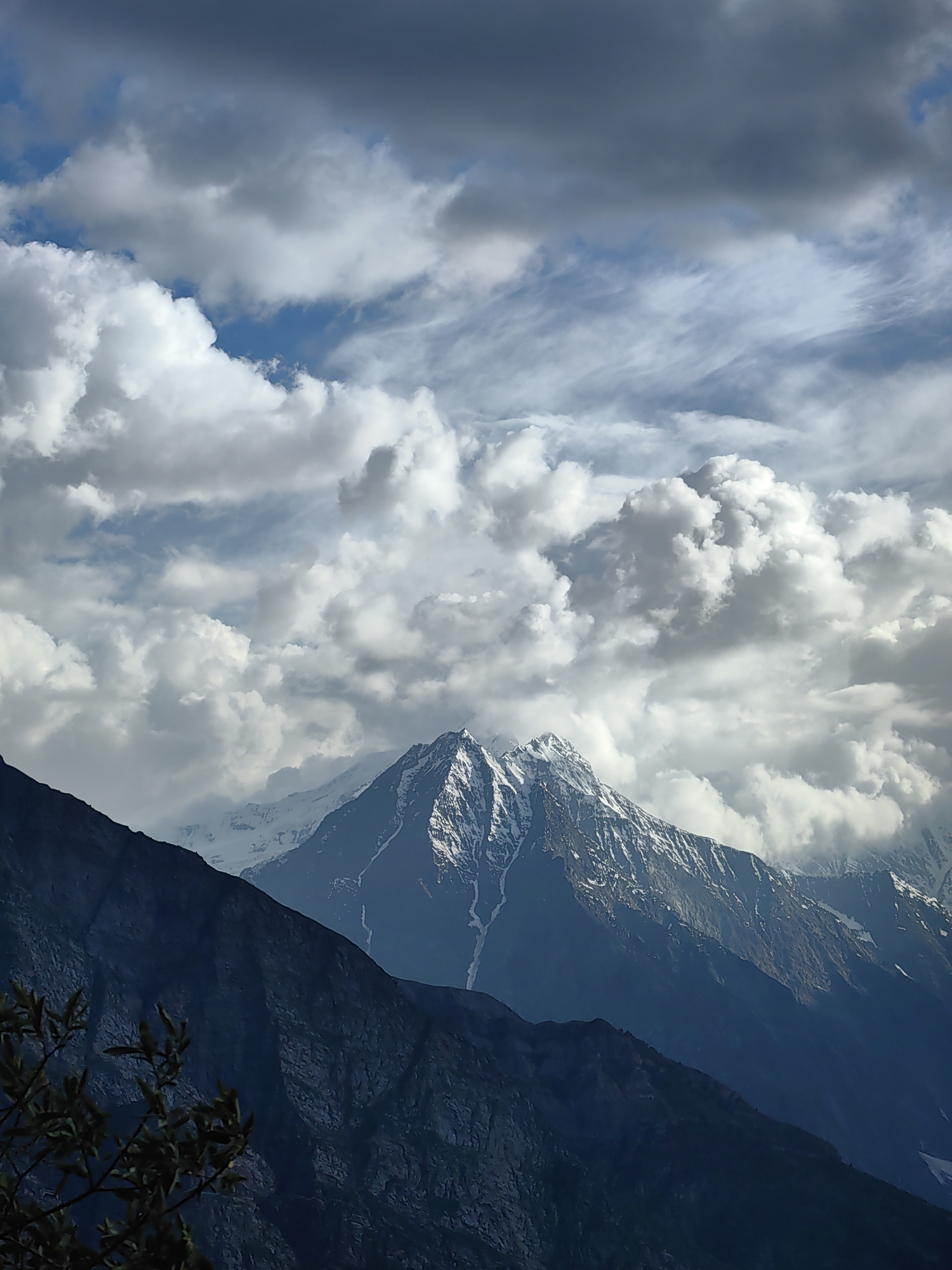 Prayer flags and snow peaks at a Keylong mountain overlook
