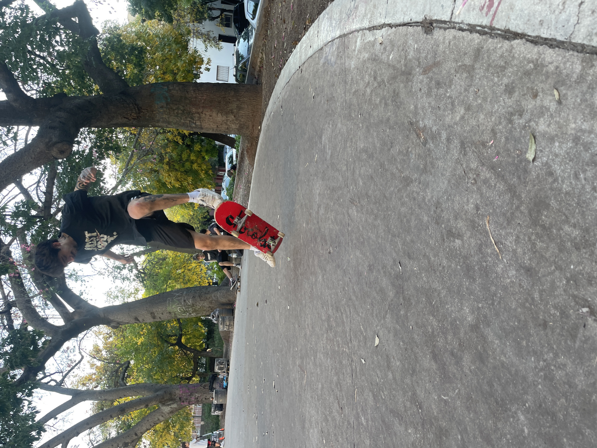 Skateboarder performs aerial tricks at Buenos Aires park