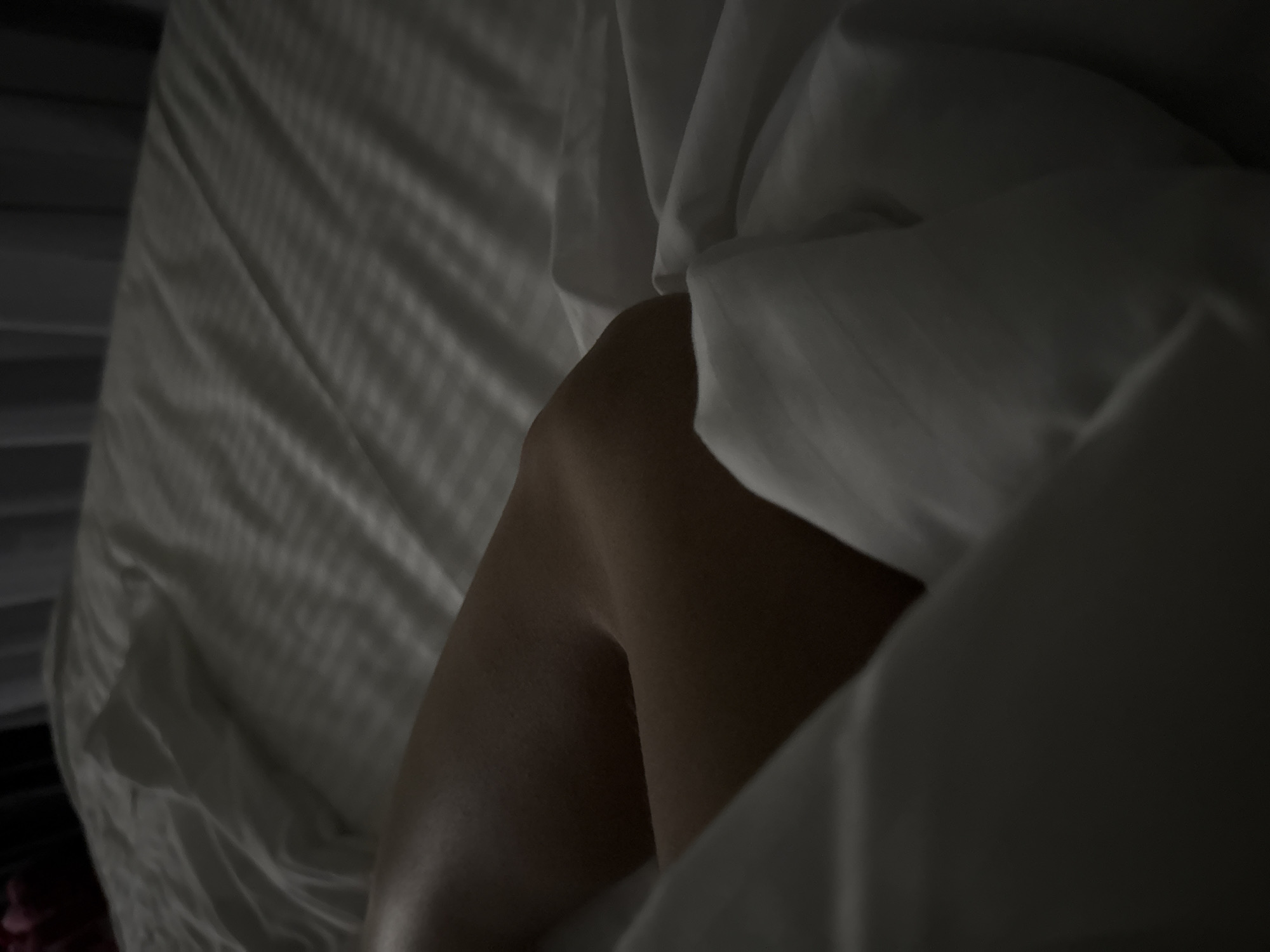Quiet bedroom moments in a dimly lit Russian interior