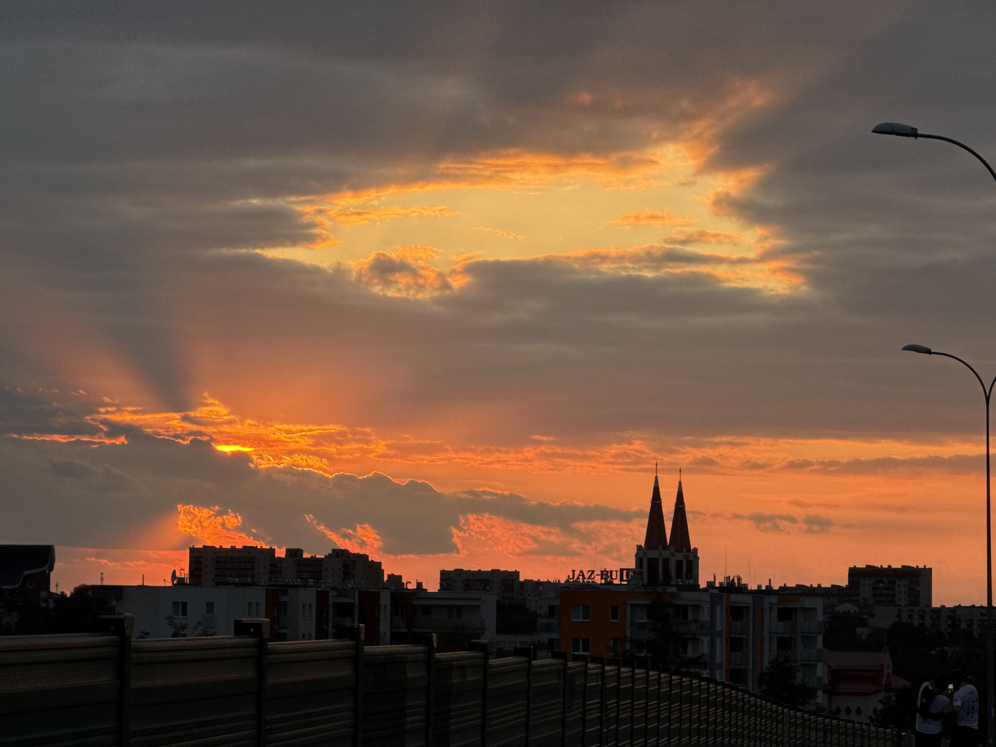 Sunset over Białystok, viewed from a bridge path