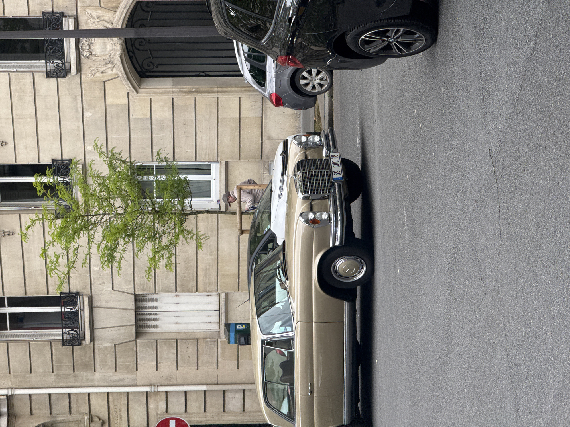 Woman spotted on Paris street near vintage Mercedes-Benz