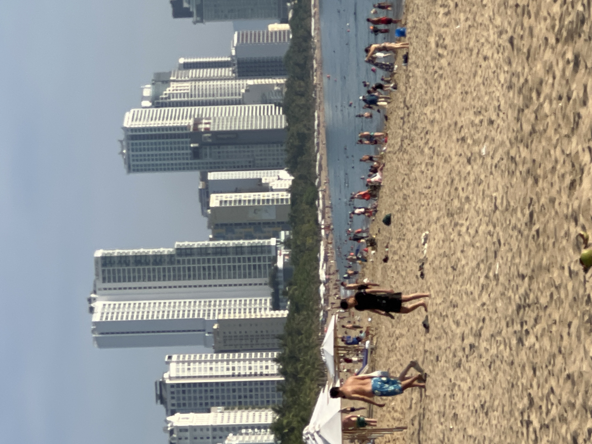Busy evening on Nha Trang beach, locals and visitors unwinding