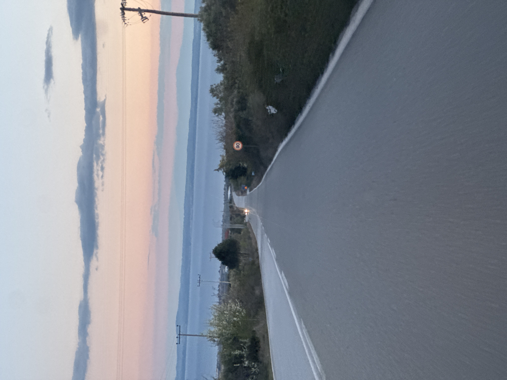 Hillside road with speed limit sign near Polygyros