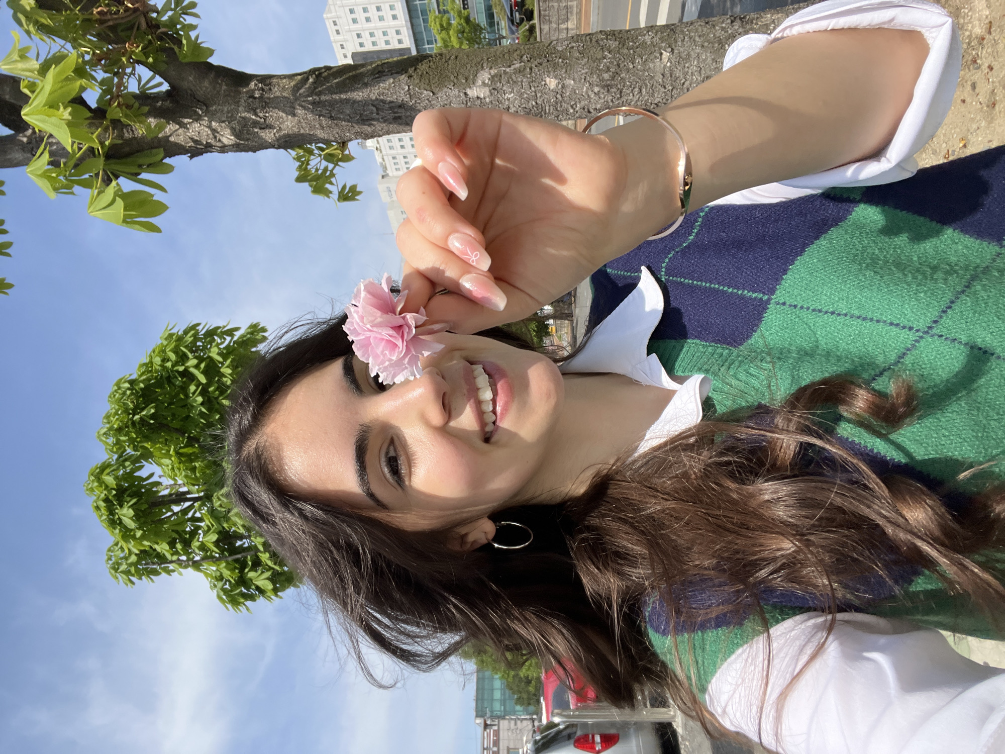 Woman takes cherry blossom selfies in nighttime Daegu