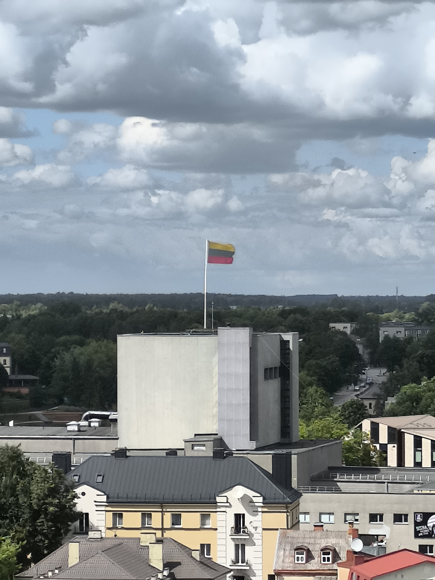 Lithuanian flag flying above a building in Panevėžys