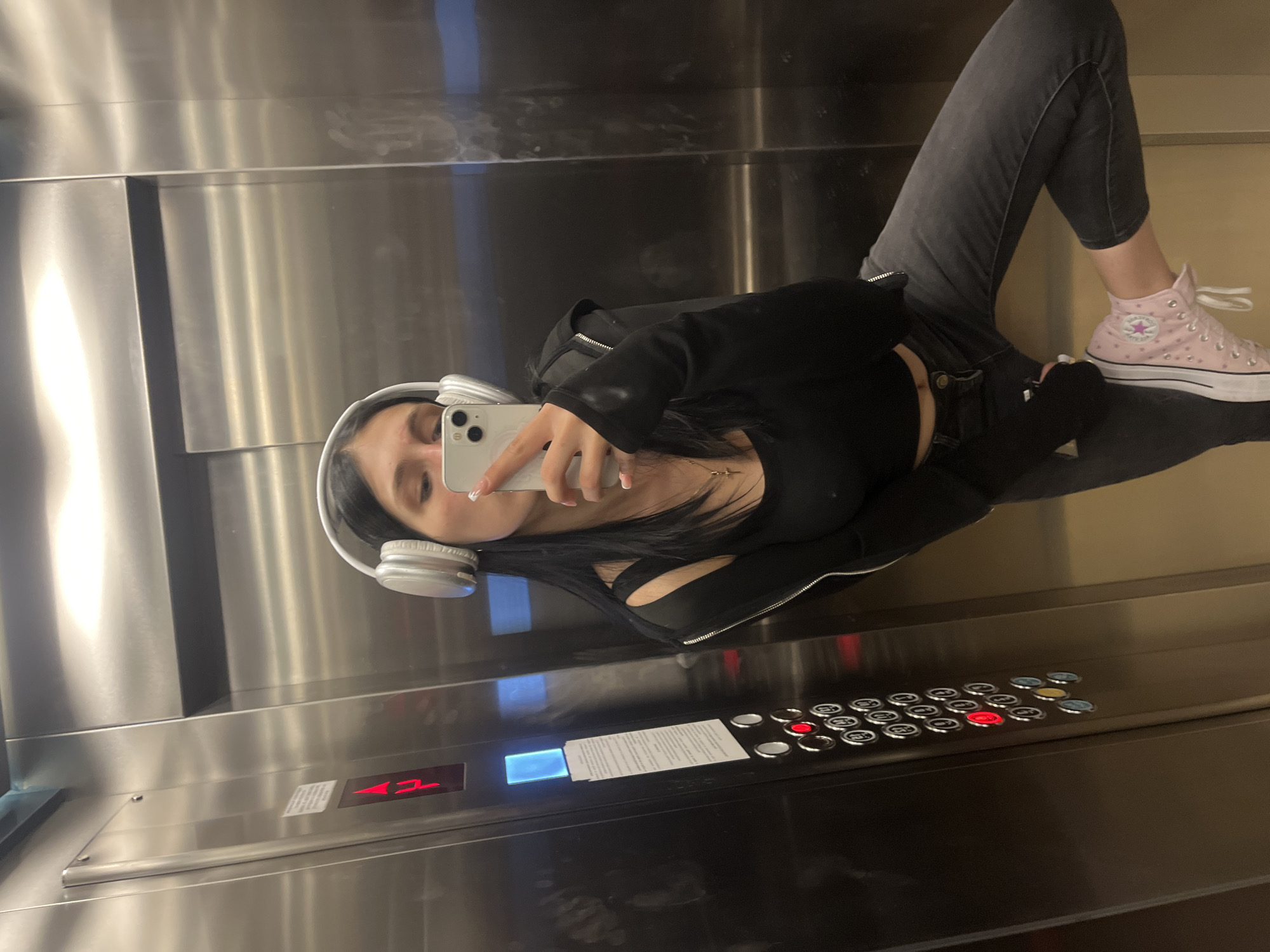 Selfies in reflective surfaces, elevator and window, same outfit.