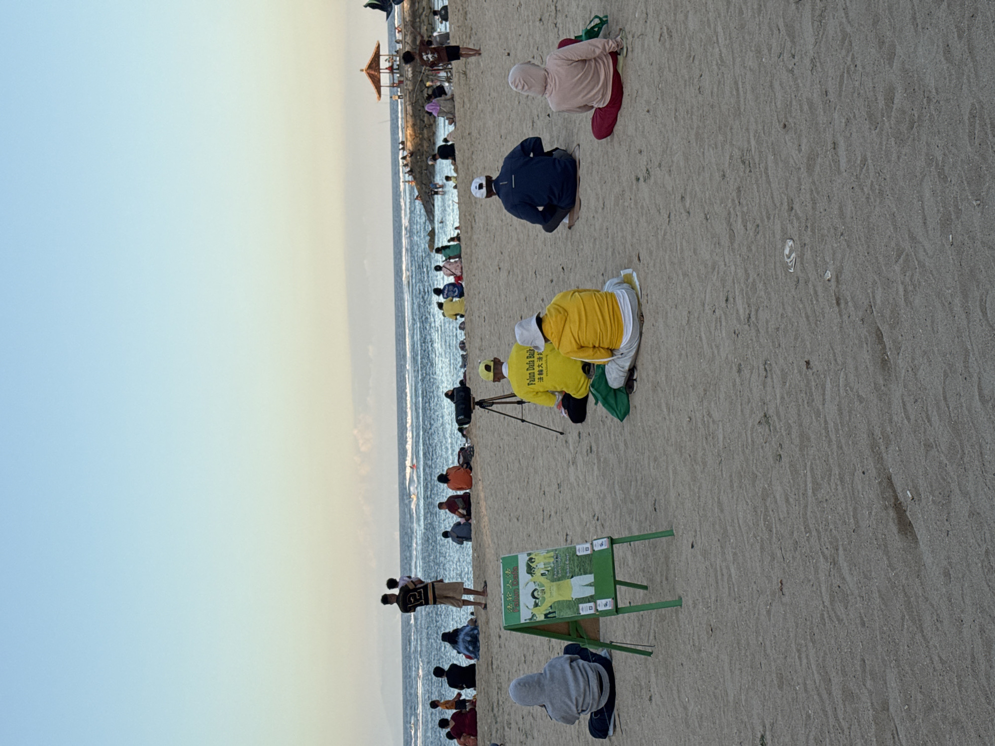 Dusk at a Kuta Selatan resort, with a group event on the beach