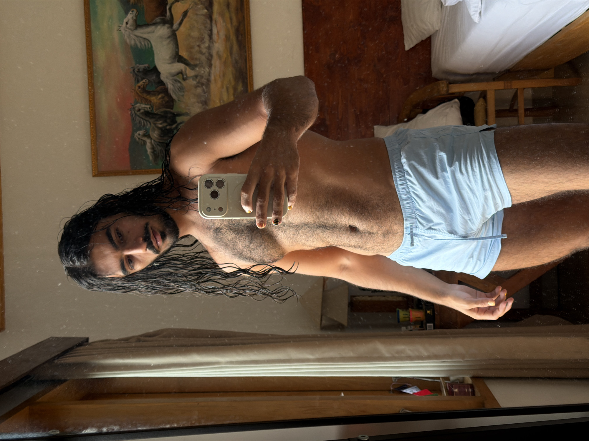 Post-swim mirror selfie in a North Kuta hotel room