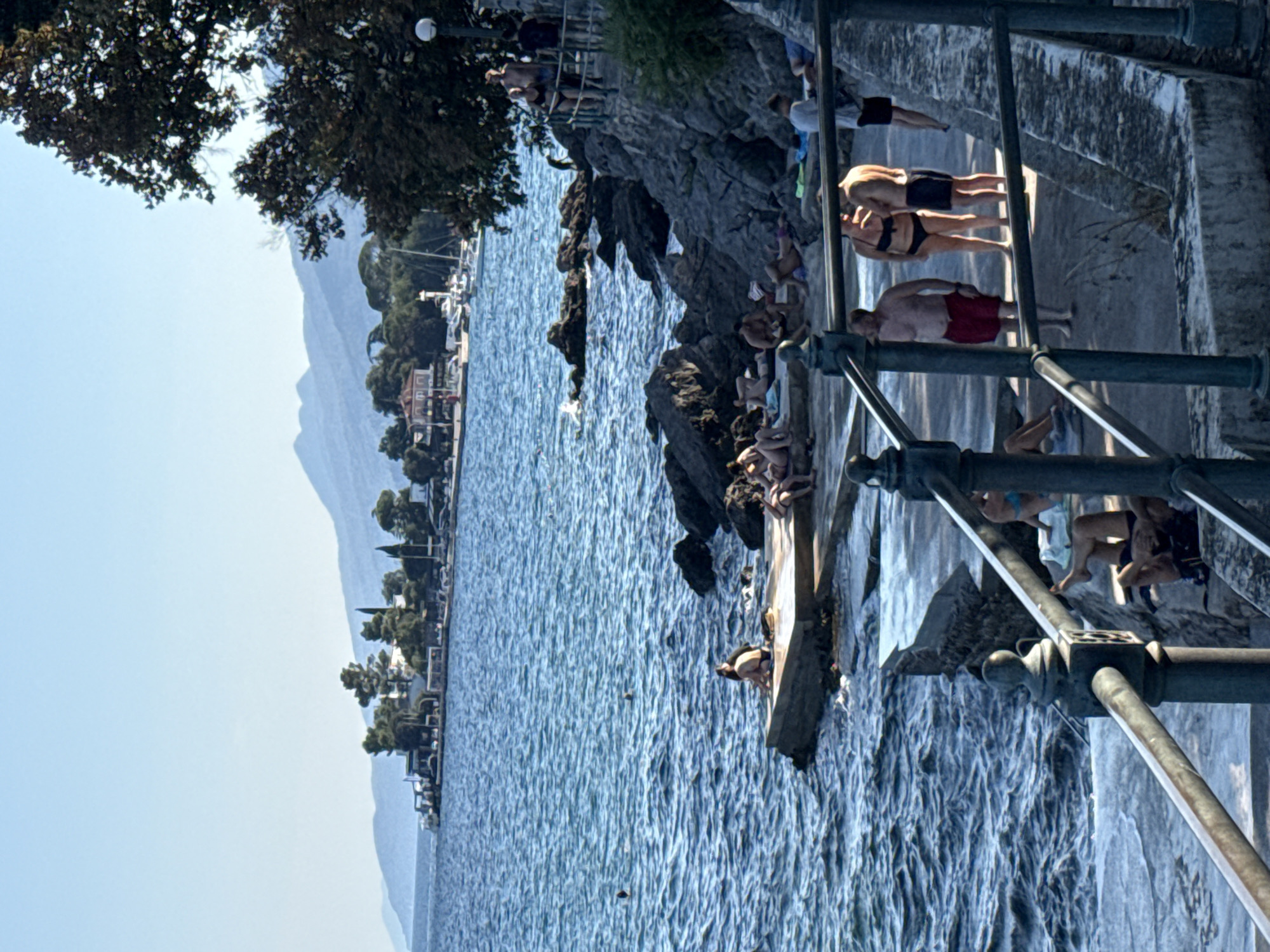 Lazy afternoon on Opatija's rocky Adriatic waterfront
