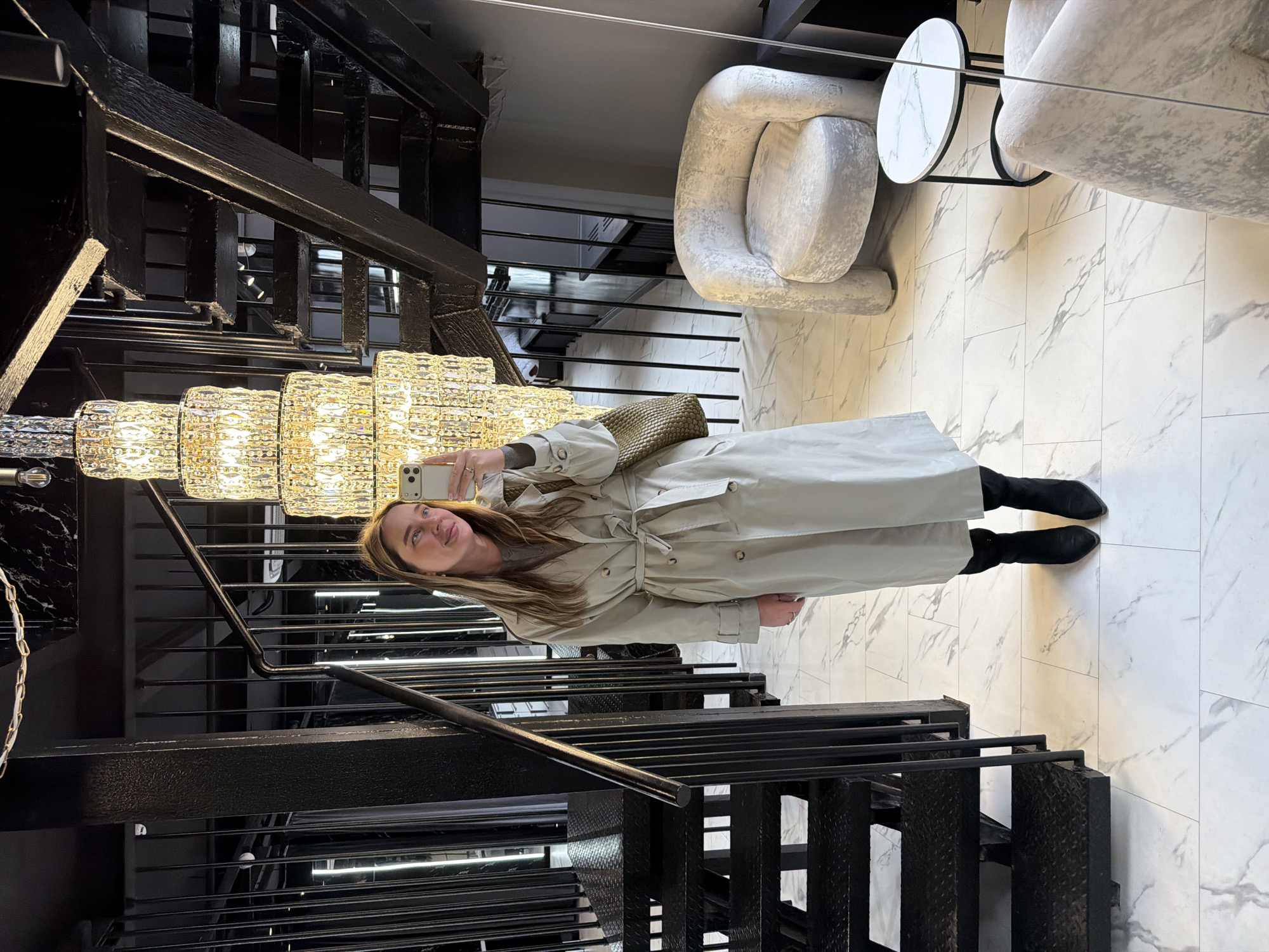 Woman takes selfies in upscale Moscow interior space