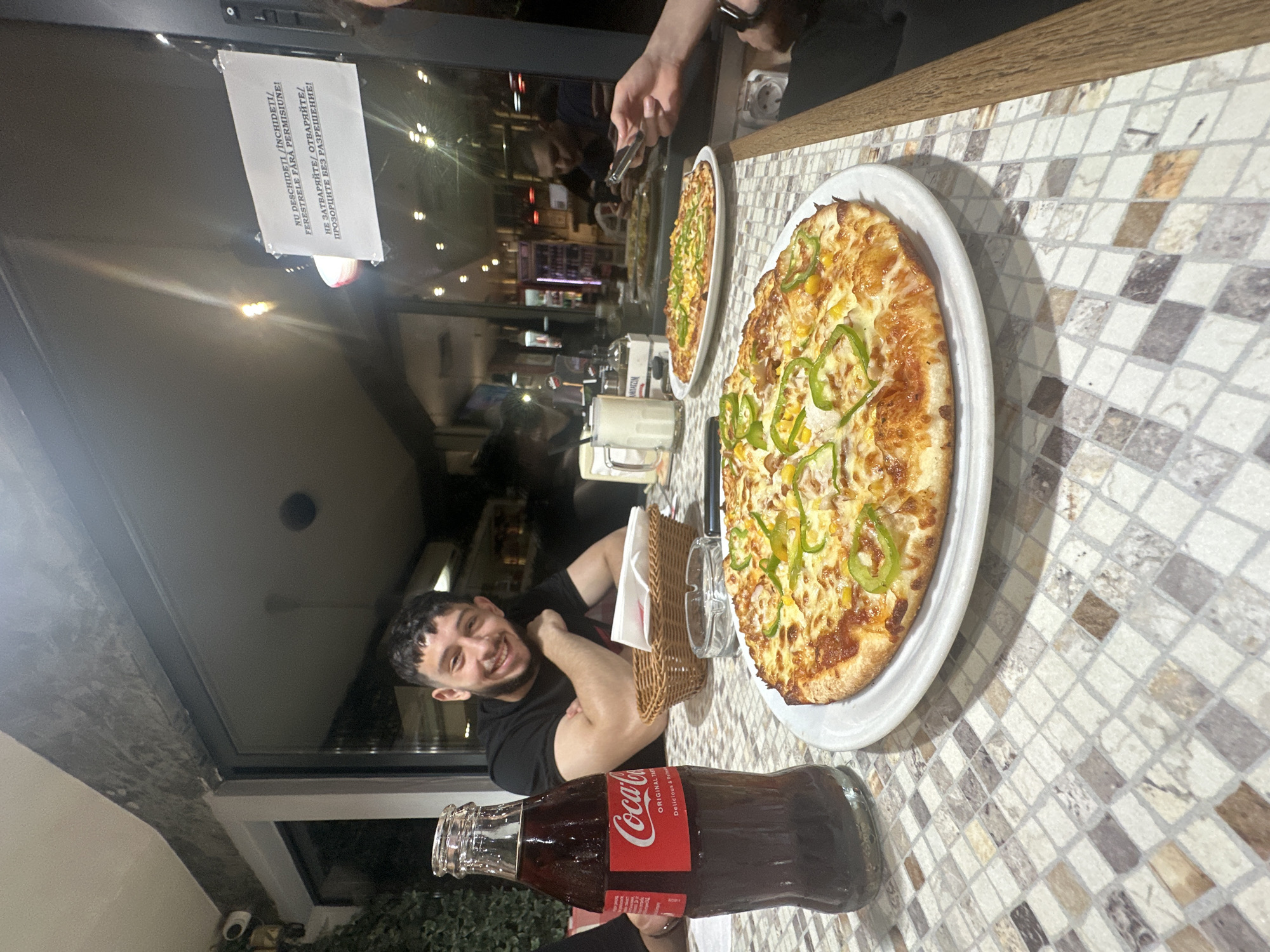 Young people gather for pizza and photos at Silistra restaurant