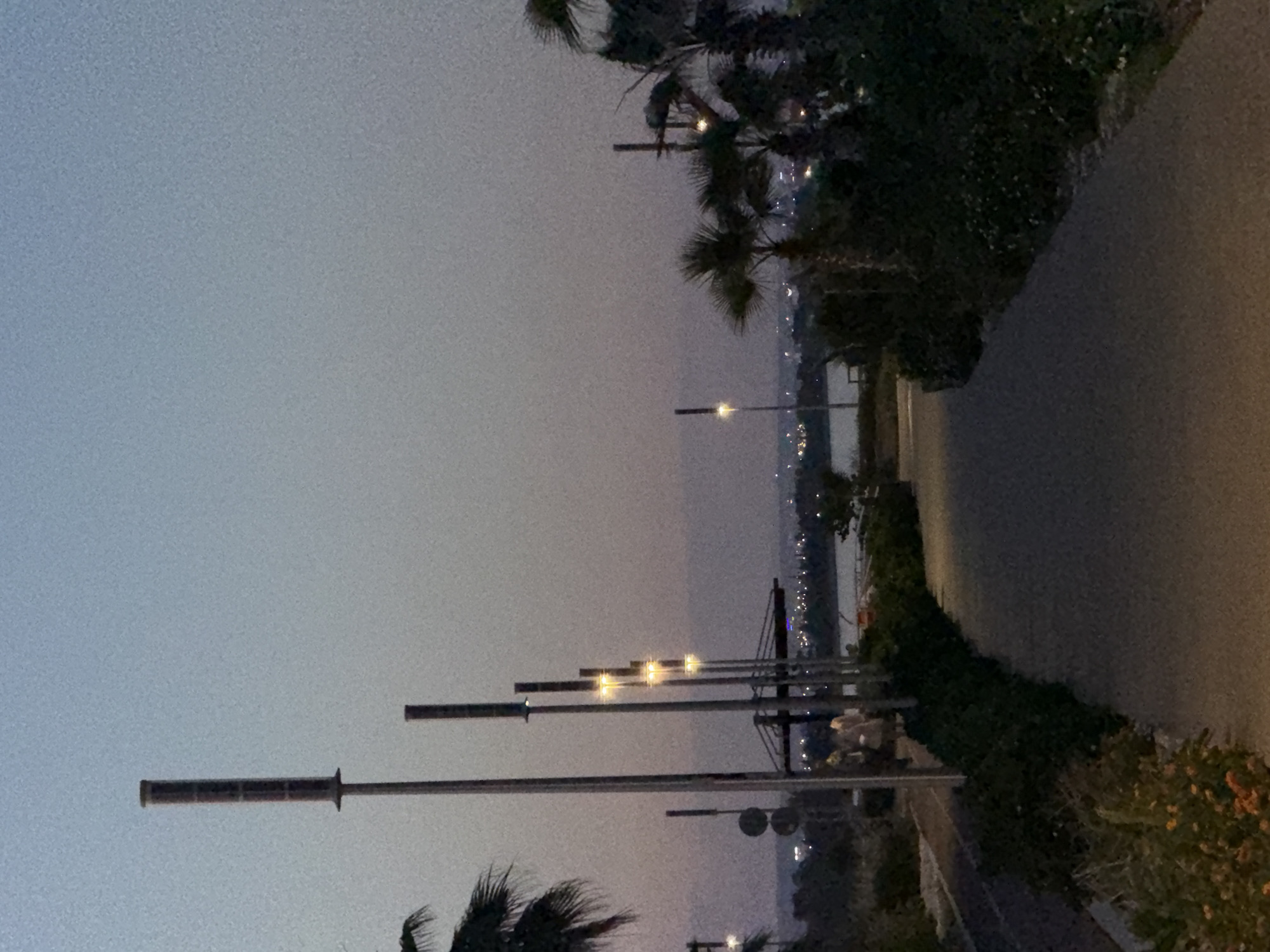 Witness documents twilight coastal promenade scene in Meneou, Cyprus