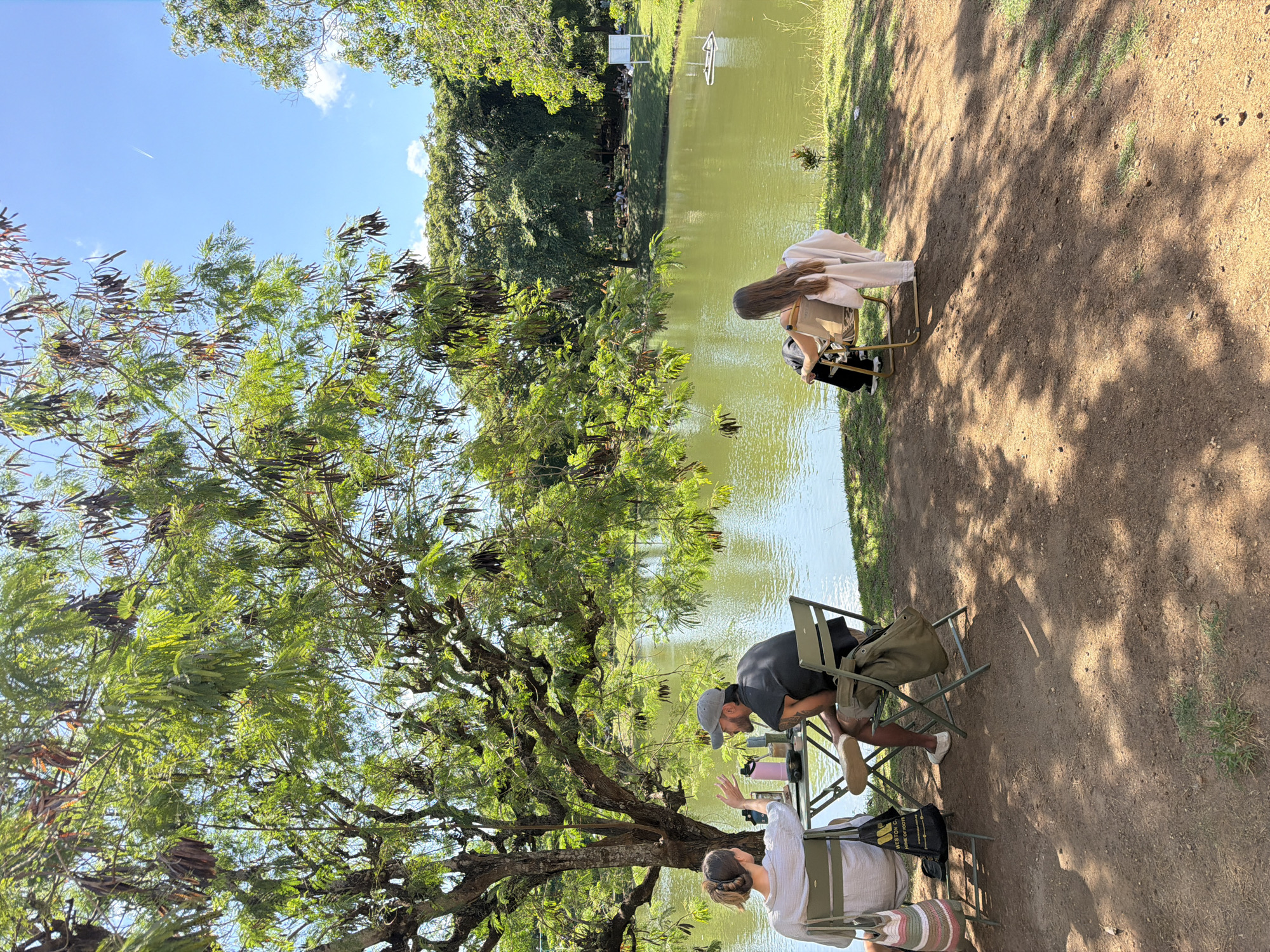 Morning lakeside gathering with ducks observed in Kuta Selatan