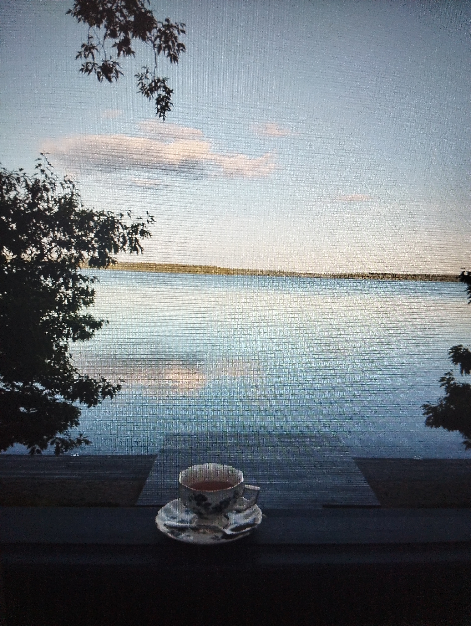 Quiet lakeside afternoon on a deck in Kingisepp