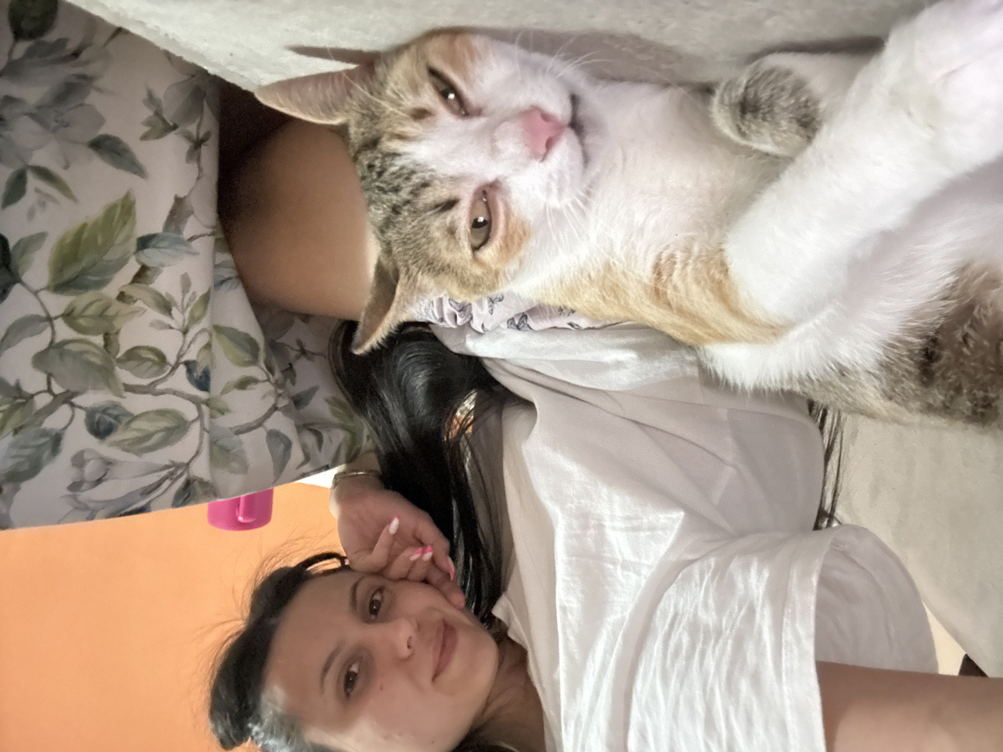 Woman takes selfies with cat at home in Bulgaria