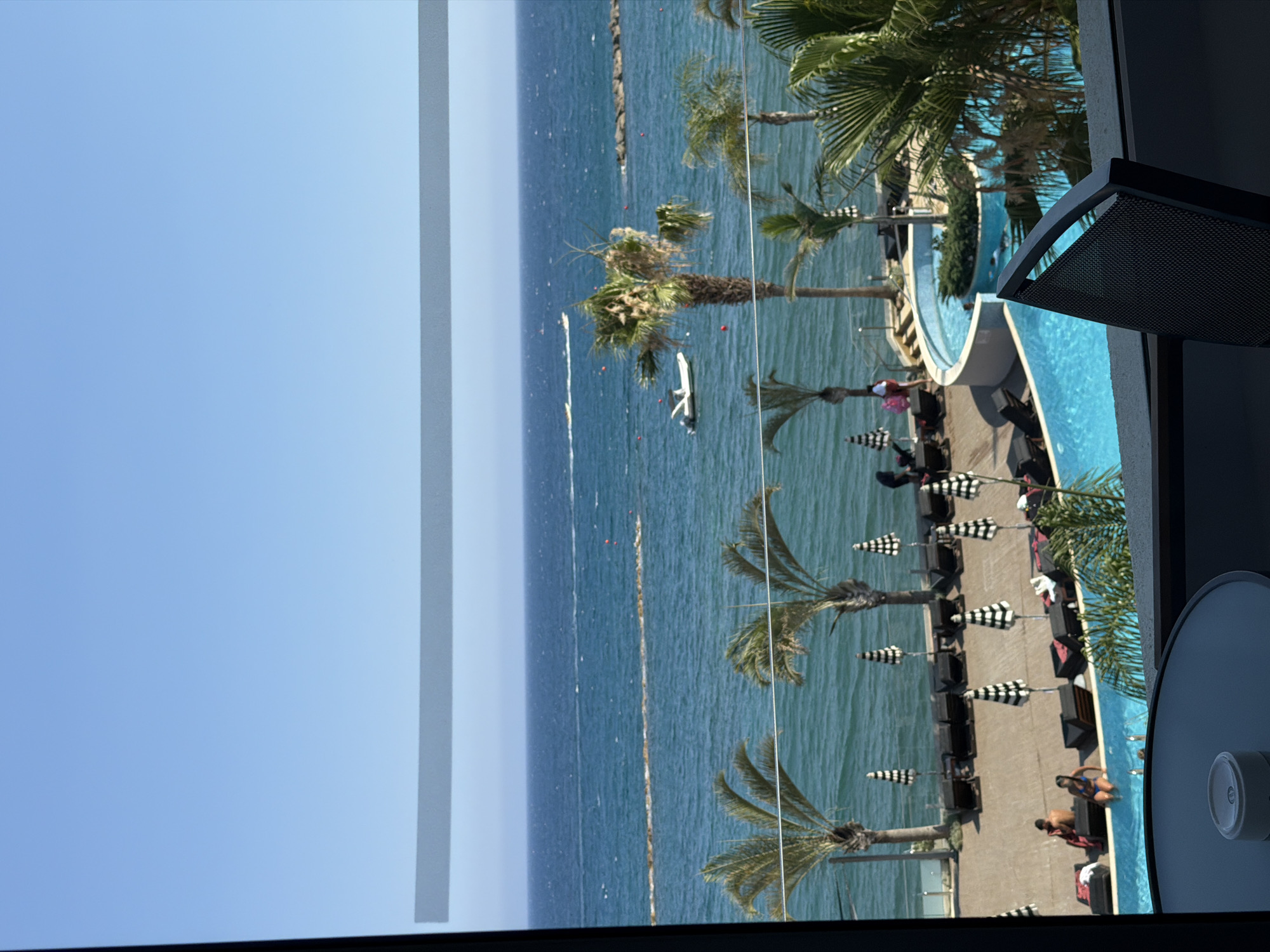 Poolside and ocean views at a beachfront resort