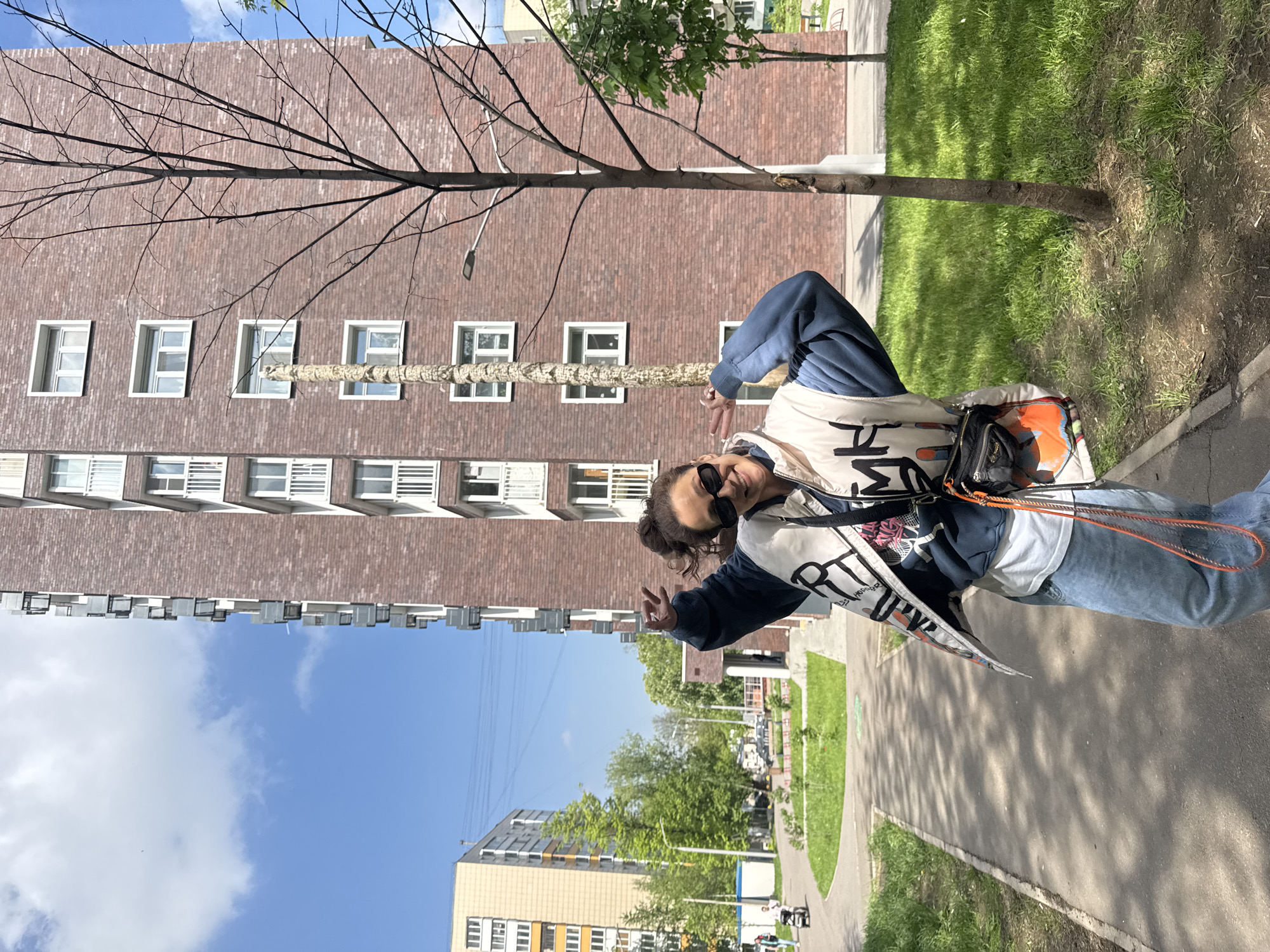 Person poses for photo in Moscow street scene