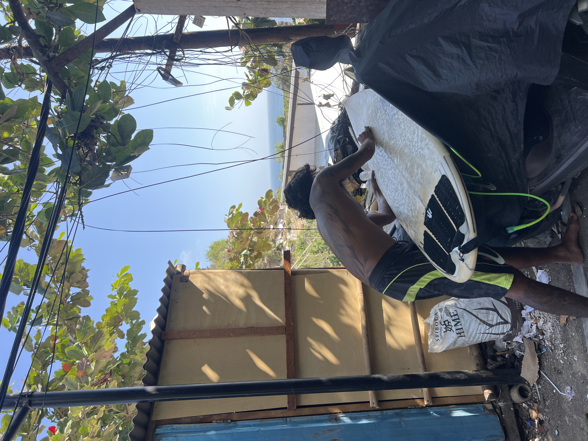 Surf, monkeys, and cliffside construction in Kuta Selatan