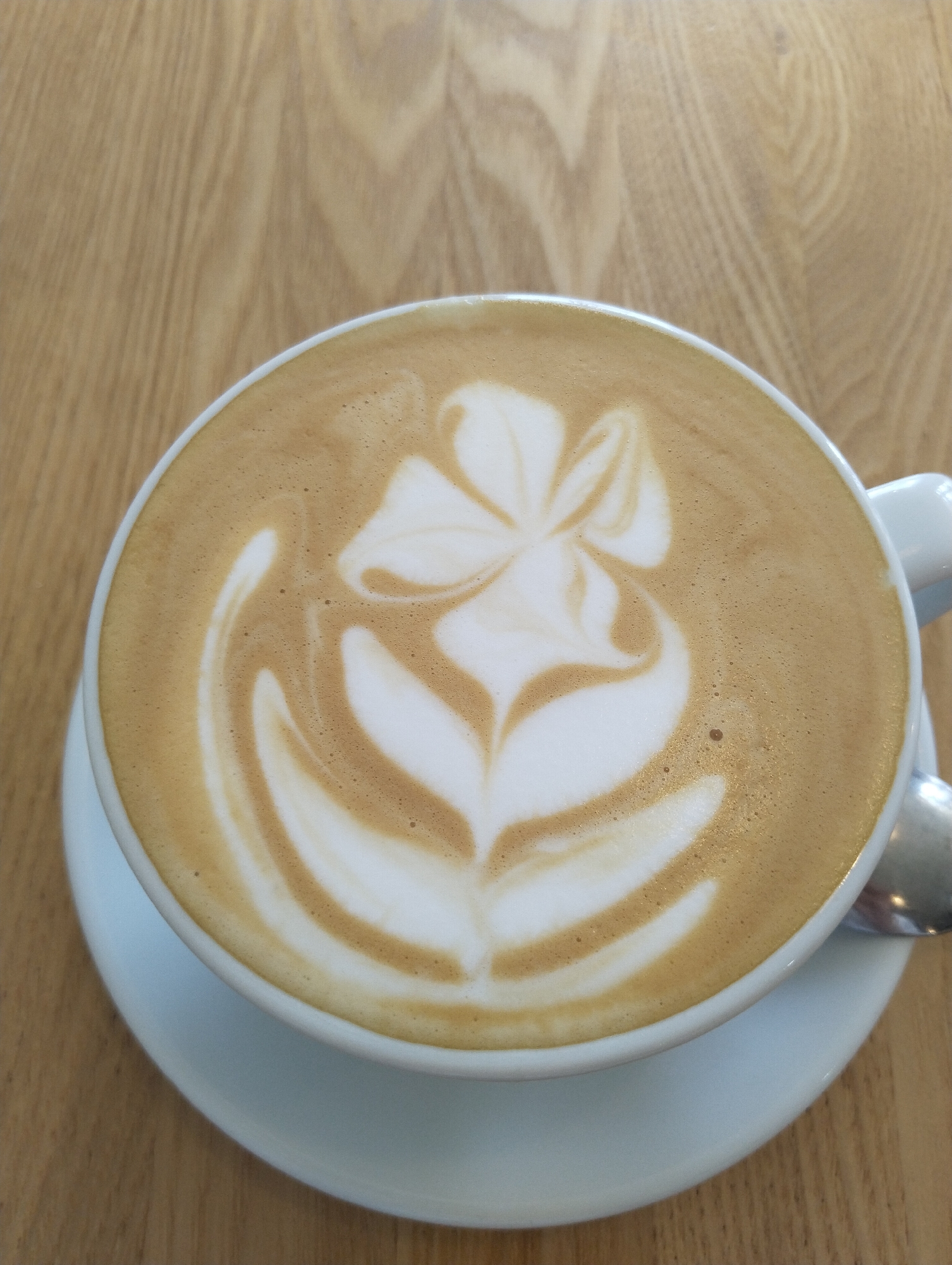 Coffee with flower latte art photographed in Moscow