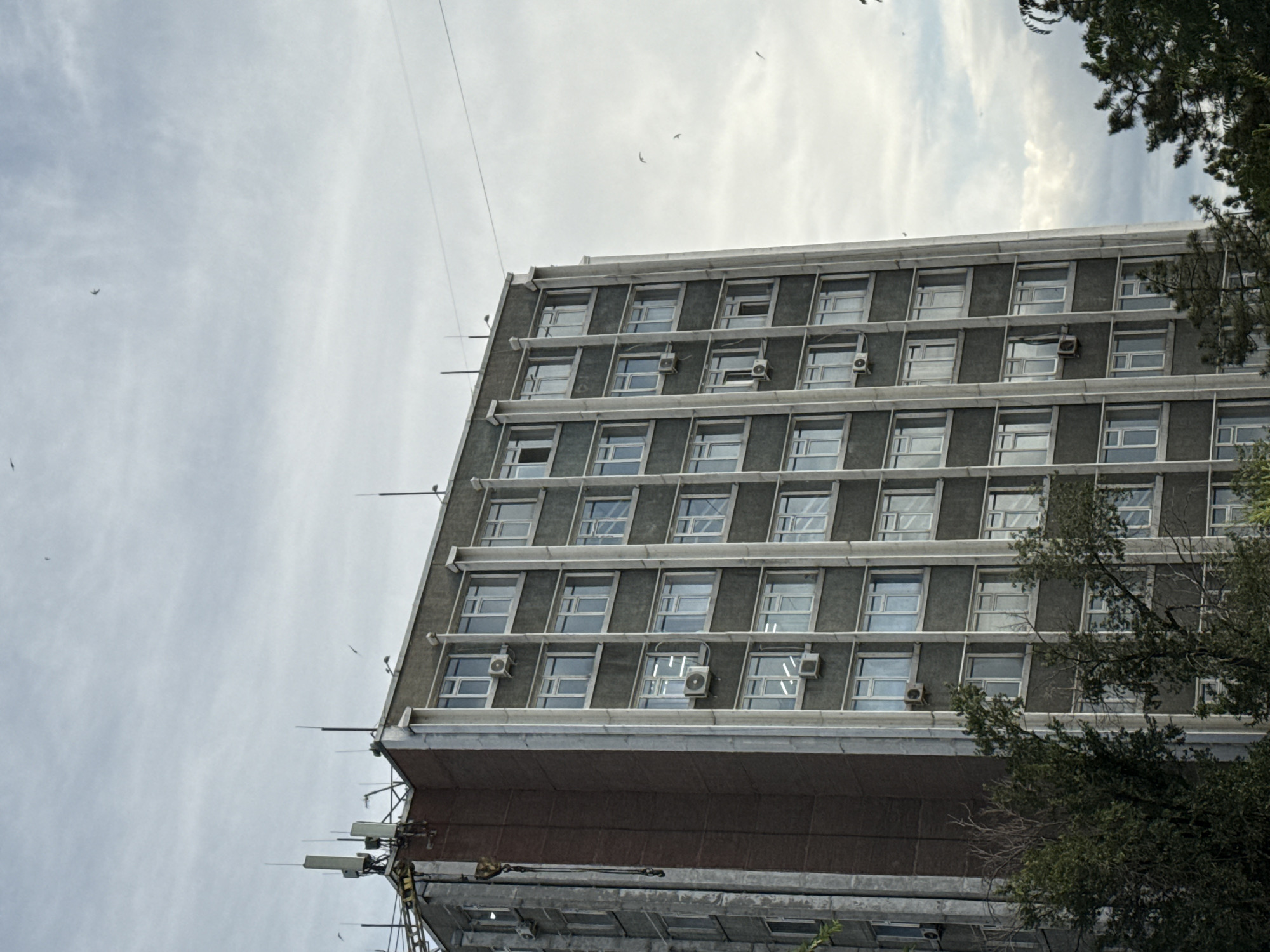 Multiple angles on a modern urban building and its surroundings