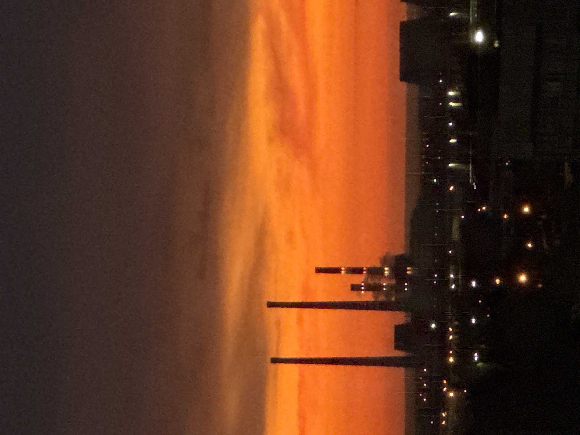 Dramatic sunset illuminates urban landscape across multiple witness perspectives