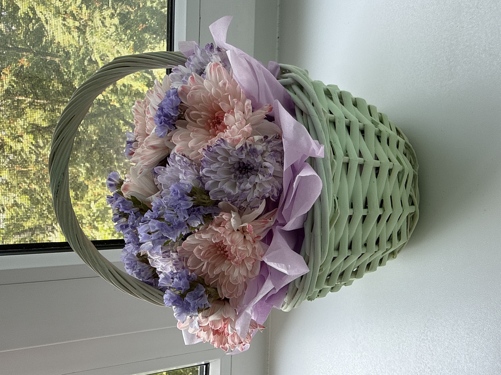Pink and white flower arrangements, plus a reptile terrarium