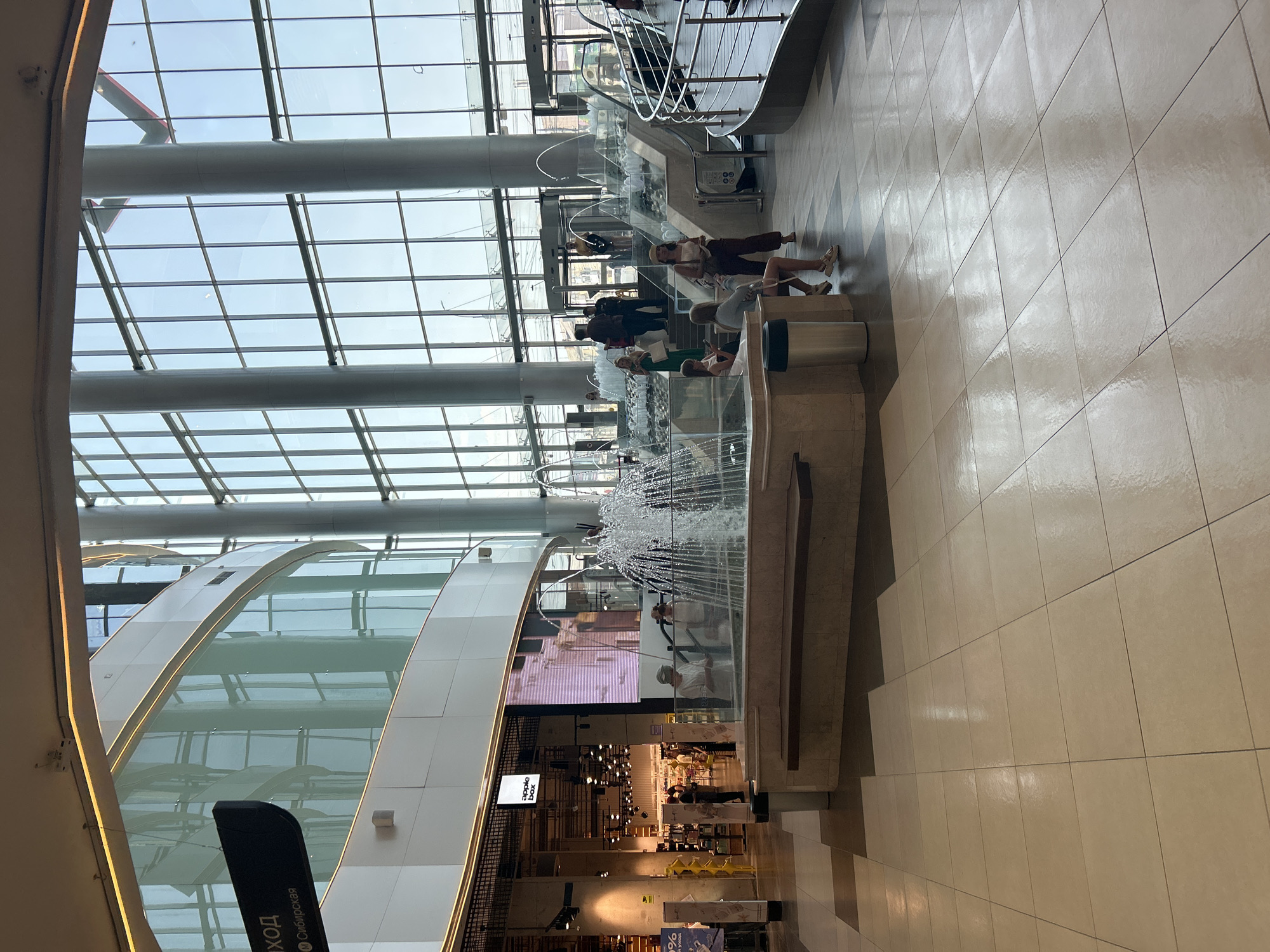 Outdoor selfies and a sunlit mall atrium, same afternoon