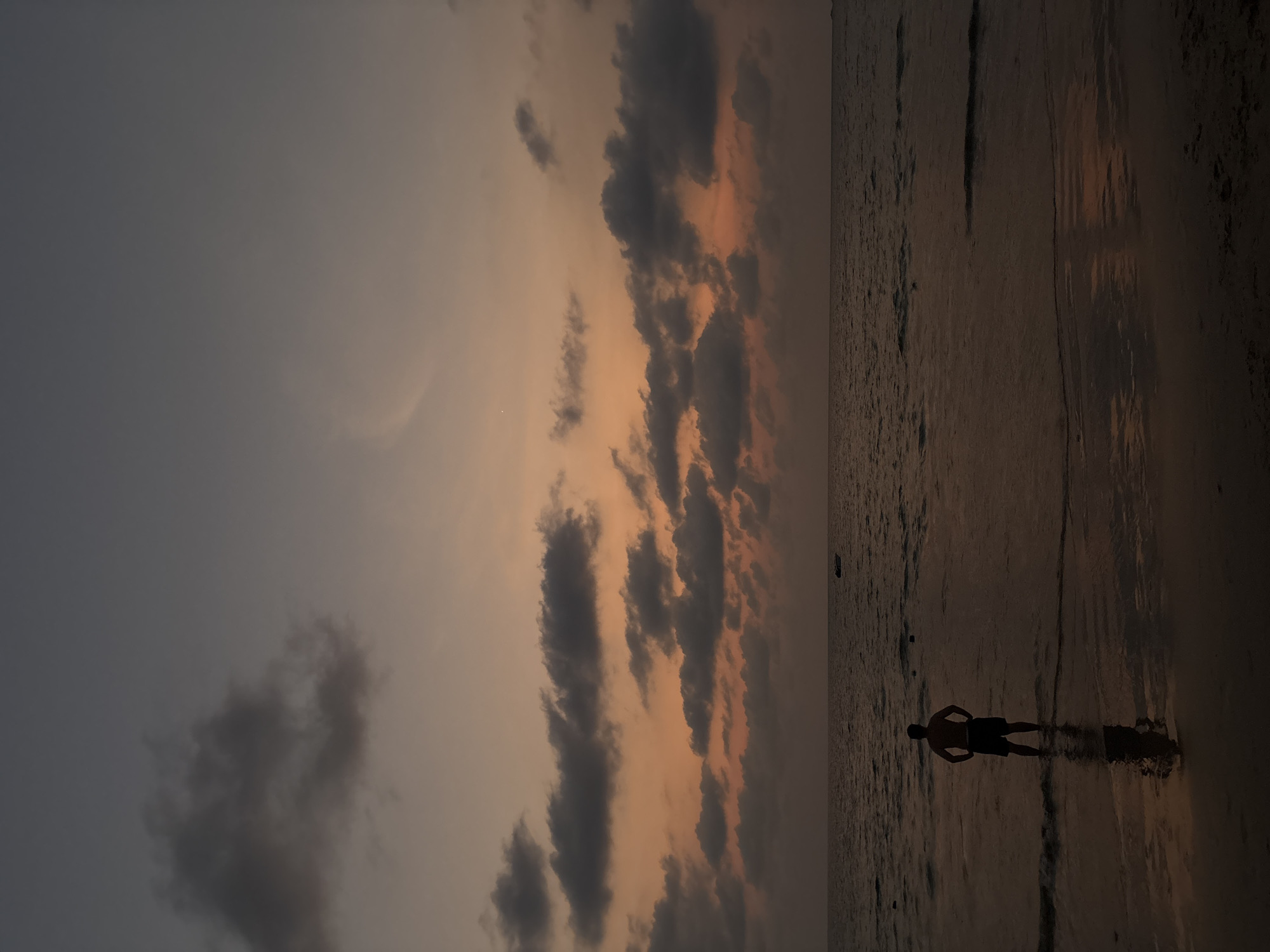 Solitary Figure Captured in Twilight Waters at Thai Beach
