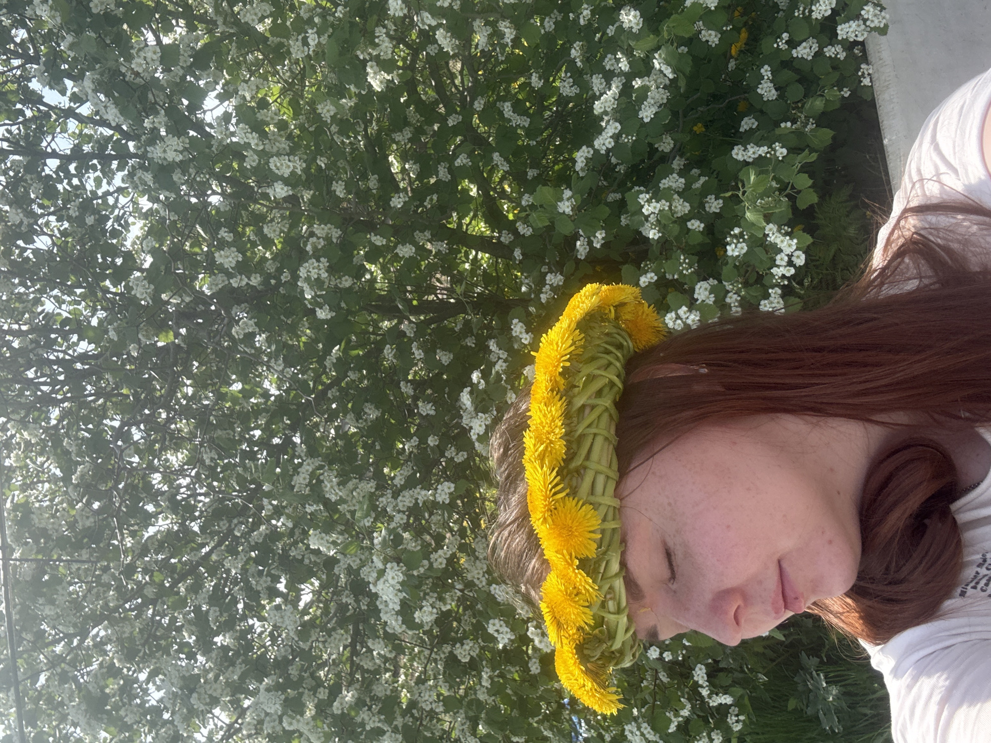 Spring morning portrait session amid dandelion field in rural Russia