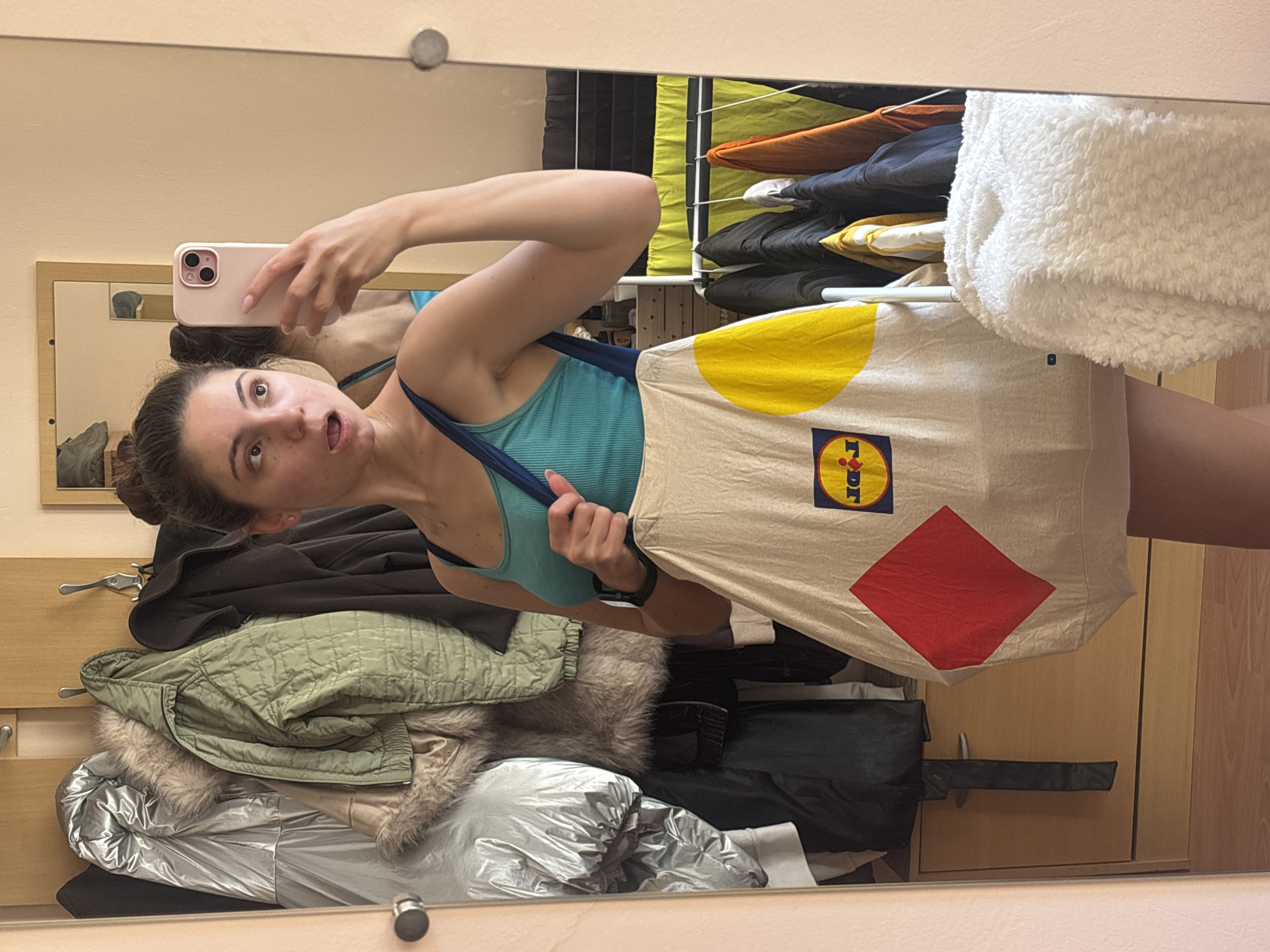 Mirror selfies around a Varna apartment with a Lidl bag
