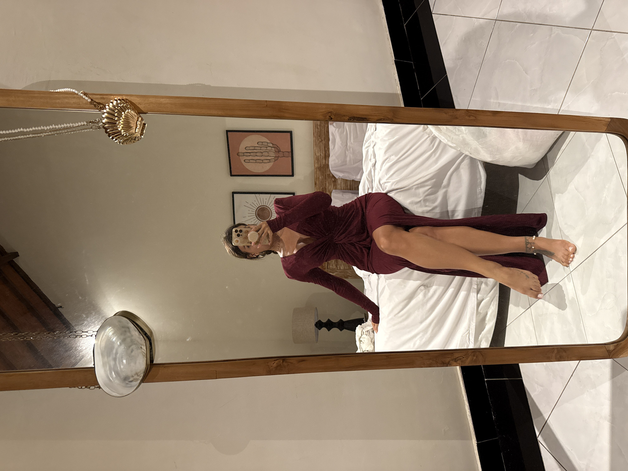 Woman takes bedroom selfies in North Kuta hotel room