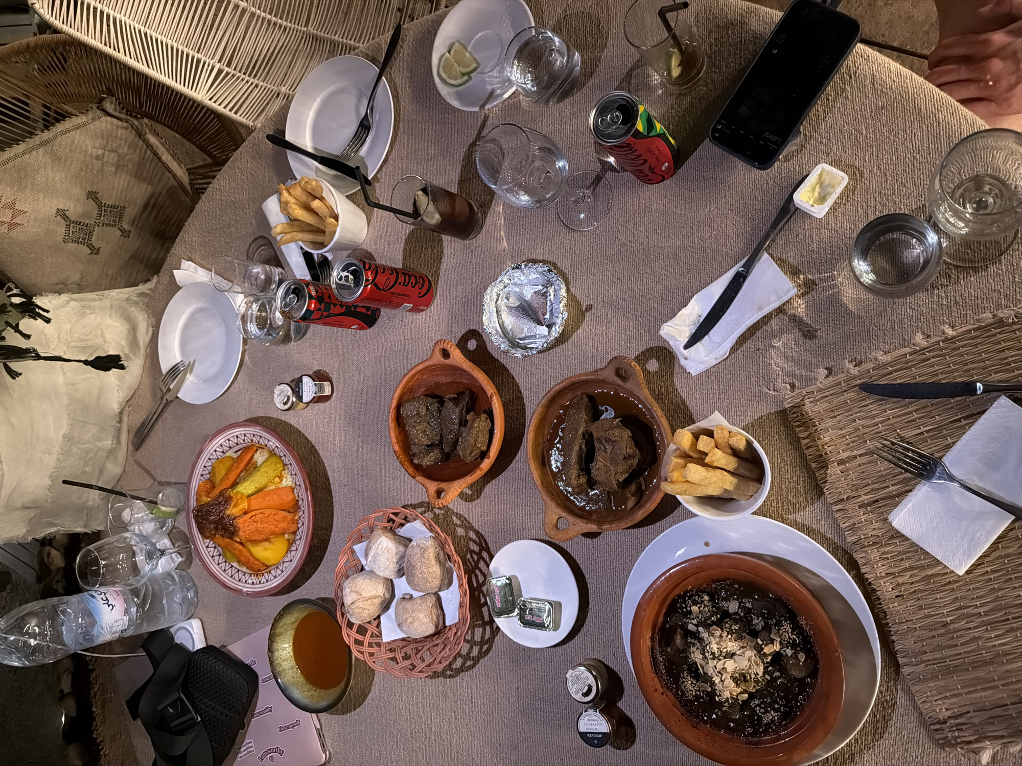 Moroccan desert dinner in Agafay, tagines and couscous under the night sky.