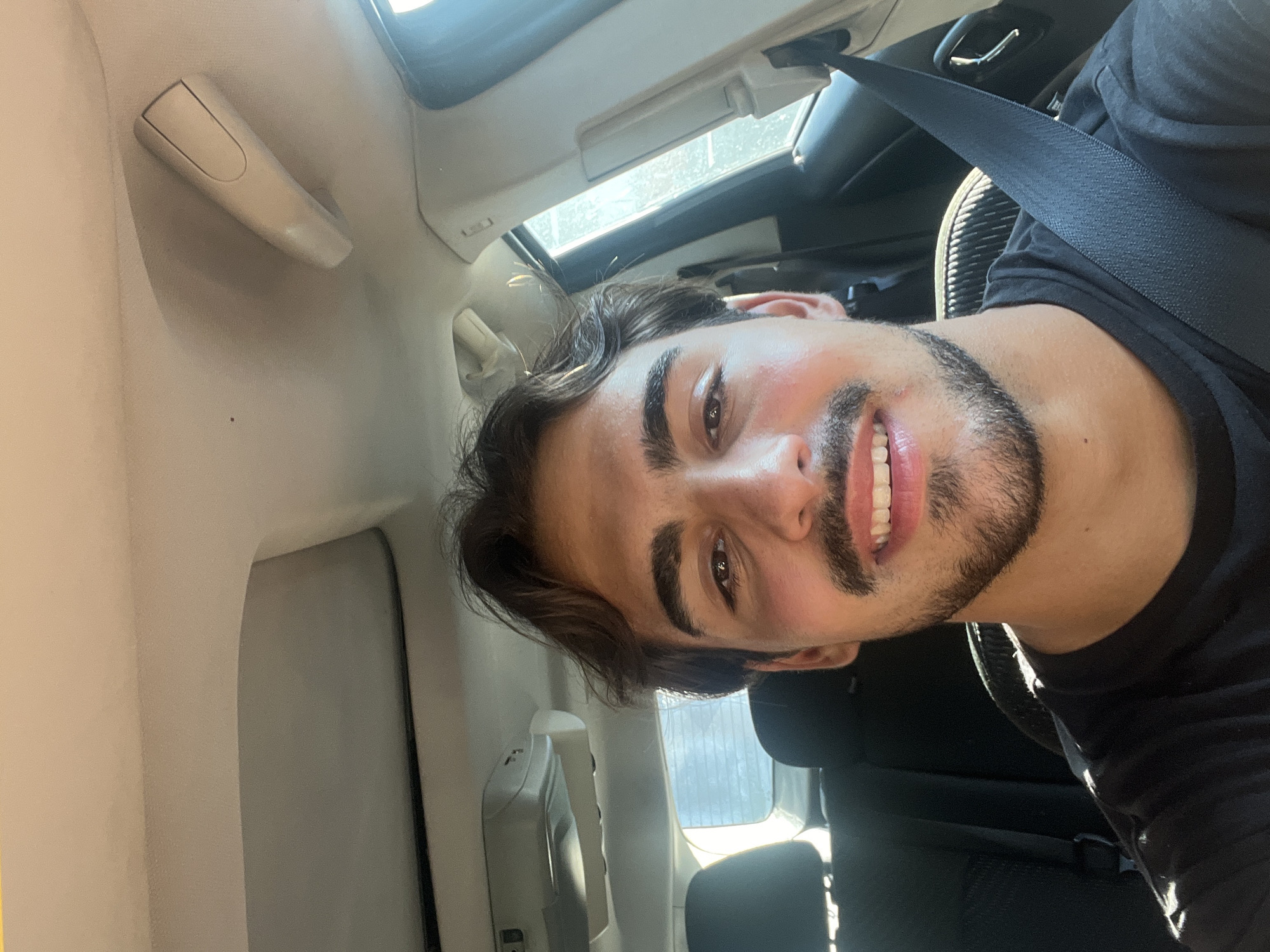 Man photographed smiling in car in Avellaneda, Argentina